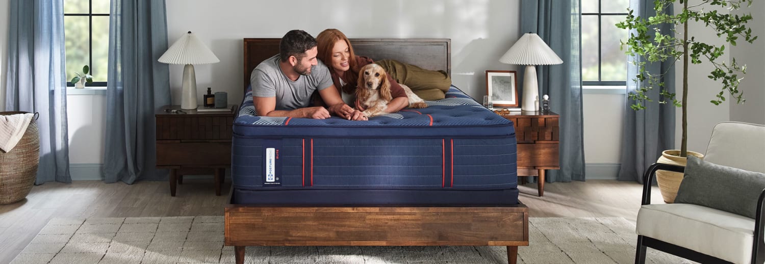 Sealy Posture-pedic Elite in bedroom with Couple and Dog