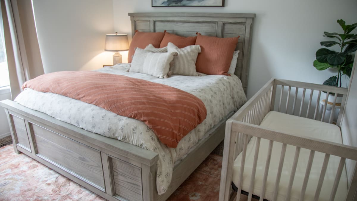 A gray wood panel bed in a cozy modern bedroom