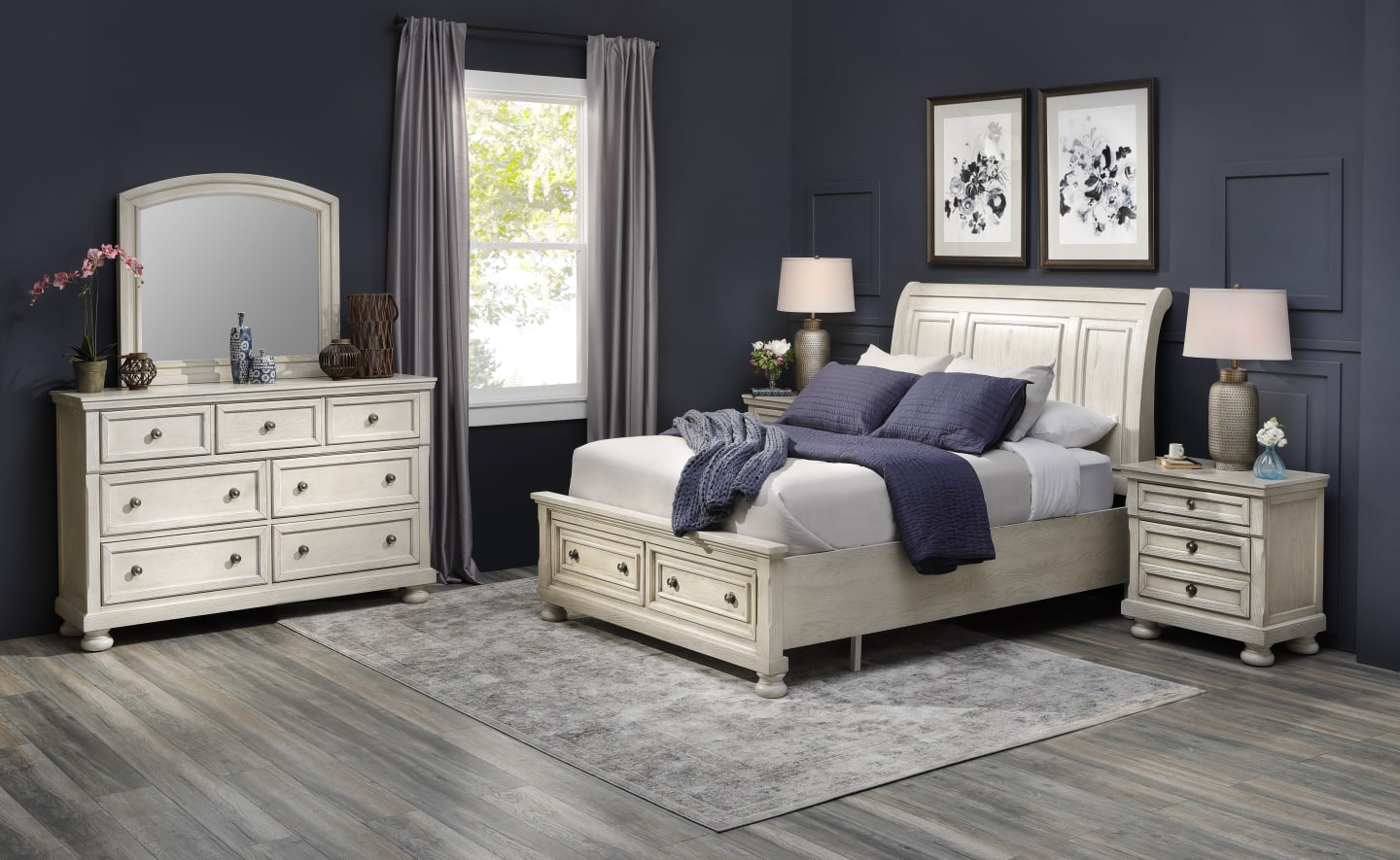White Wooden Sleigh Bed Set with matching pieces in a dark colored bedroom