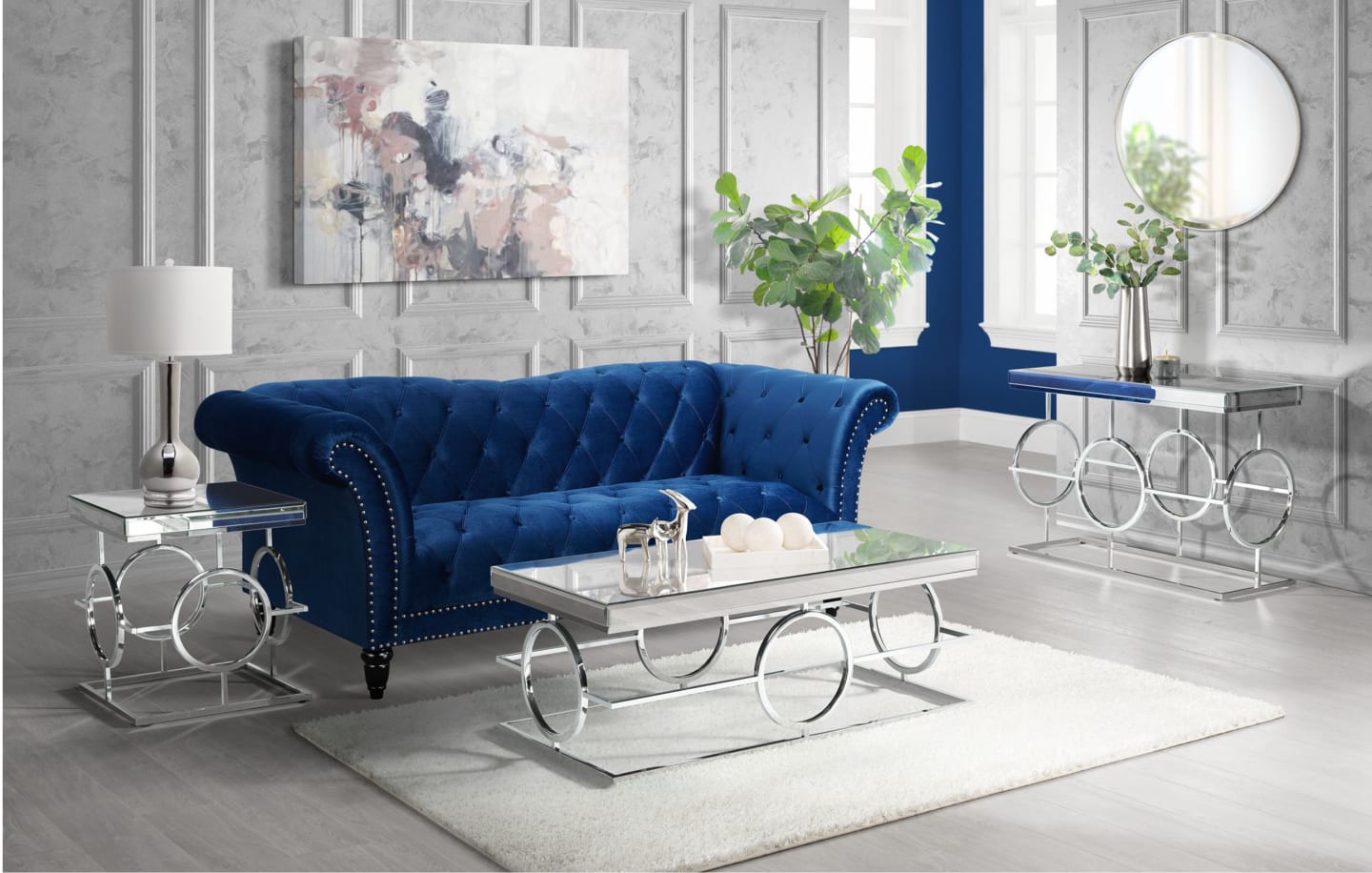 Glamorous occasional tables with a curvy blue sofa in a modern room