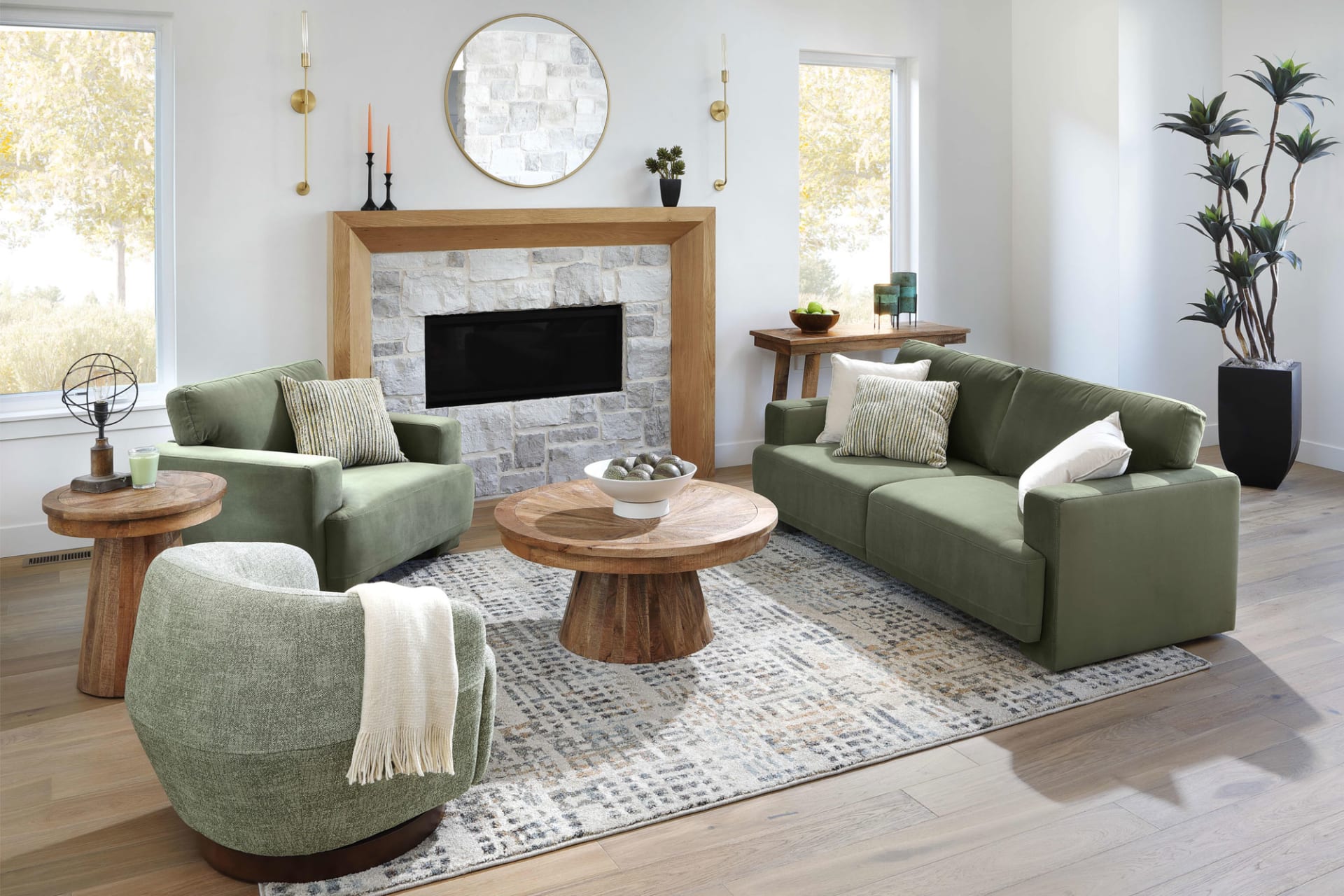 Sage Green Sofa Group in living Room With round wooden pedestal coffee table