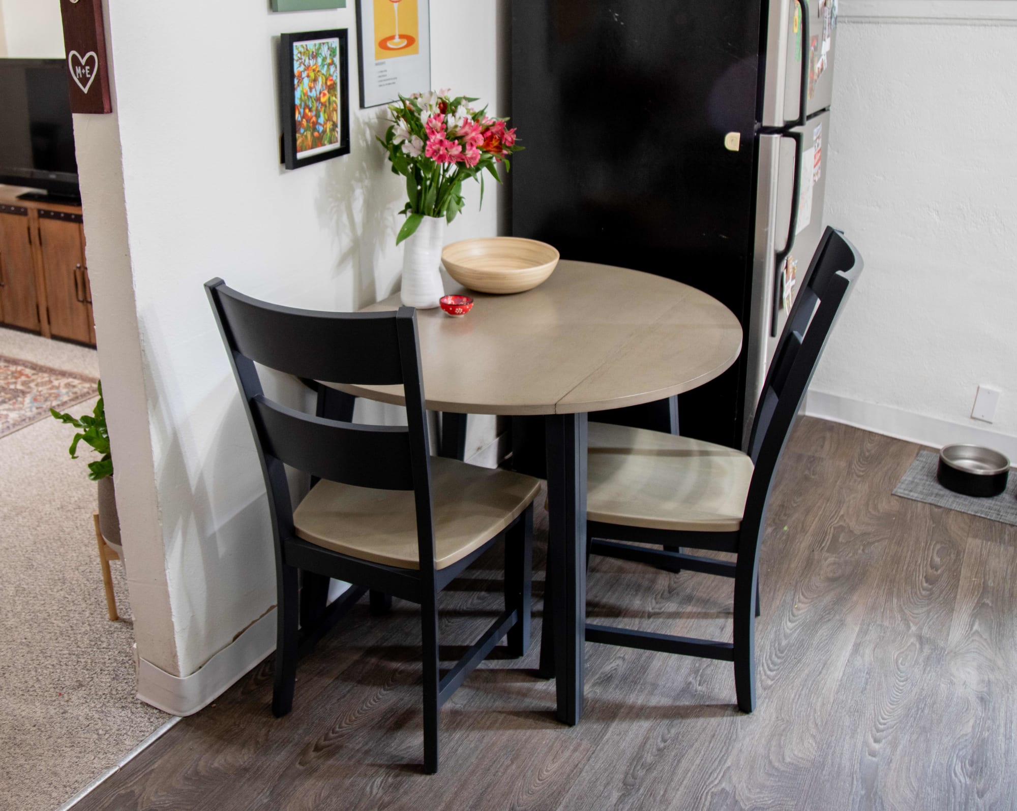 The Merrill Creek 3 Pc. Round Dining Room Set styled in Mackinley's apartment kitchen
