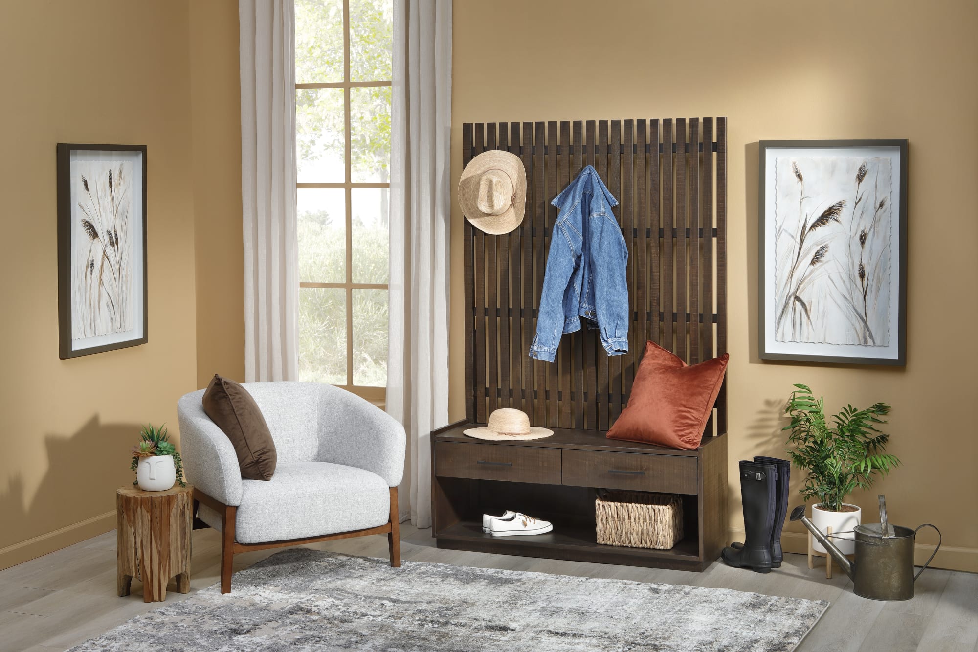 A wood hall tree organizer in an entryway with a white accent chair and growing plants
