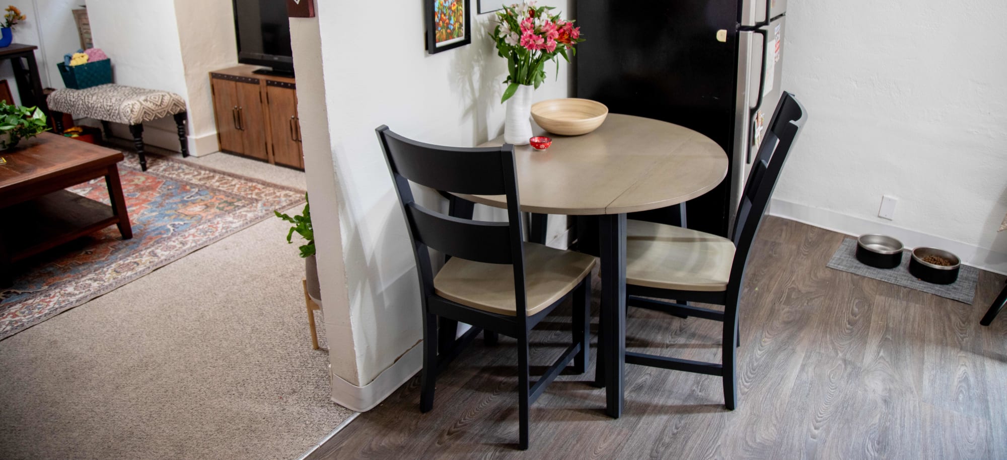 The Merrill Creek 3 Pc. Round Dining Room Set styled in Mackinley's apartment kitchen