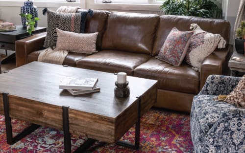 Brown Sofa, Brown Coffee table on a red colorful rug and other boho decoratively styled products