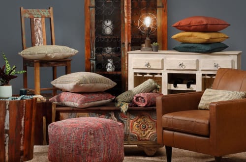 Boho inspired collage including Pillows, Throws, Accent Chairs, Lighting, and Cabinets