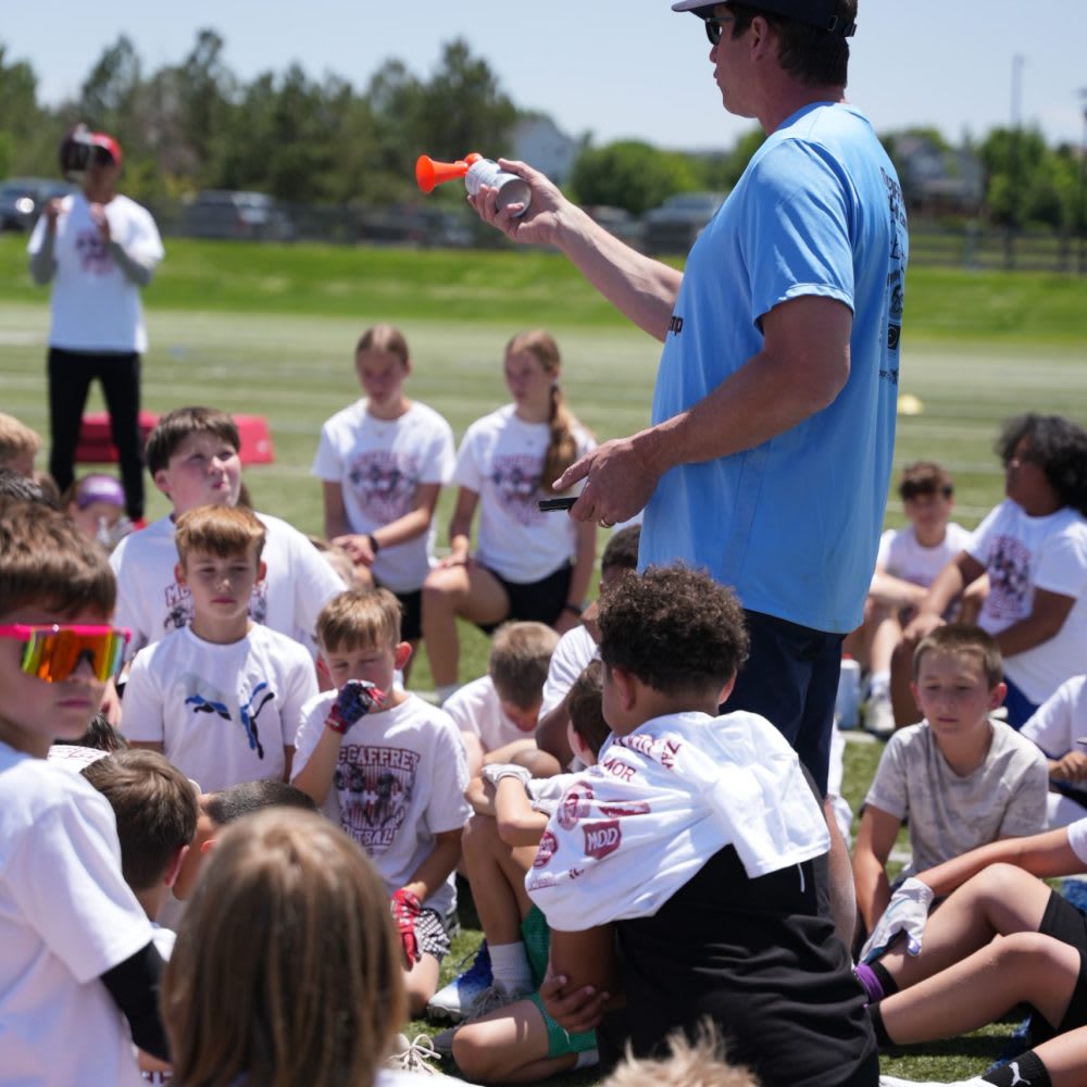 Ed McCaffrey coaching at his football camp