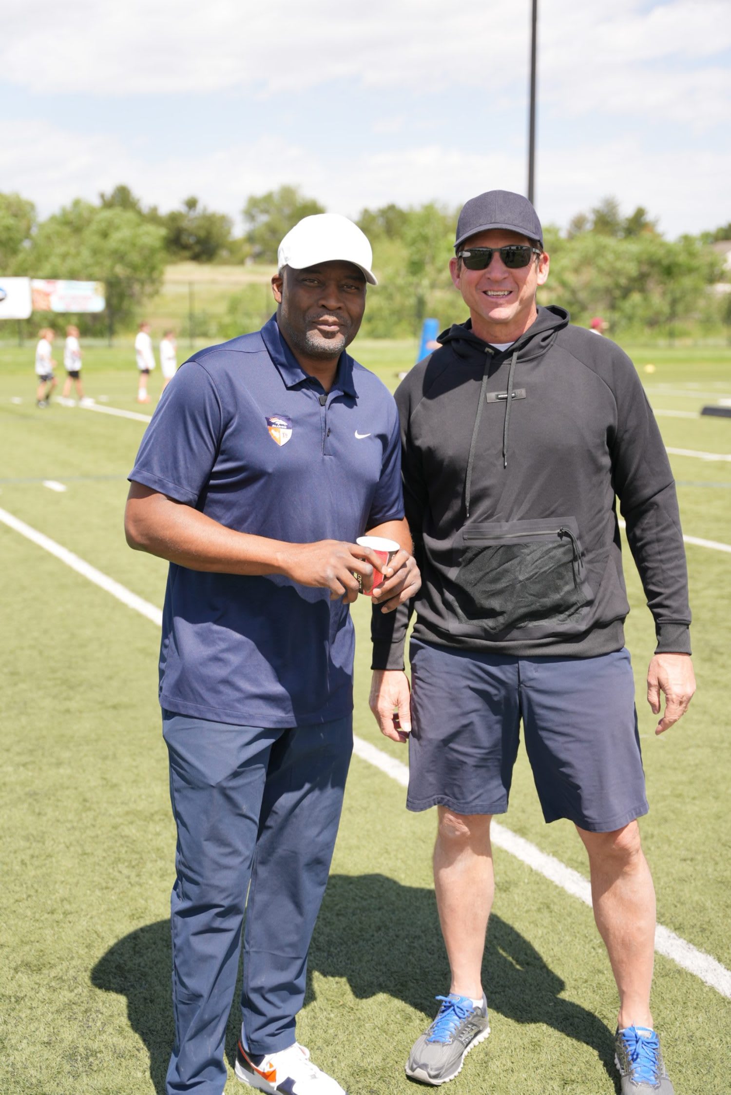 Ed McCaffrey and assistant coach close up shot