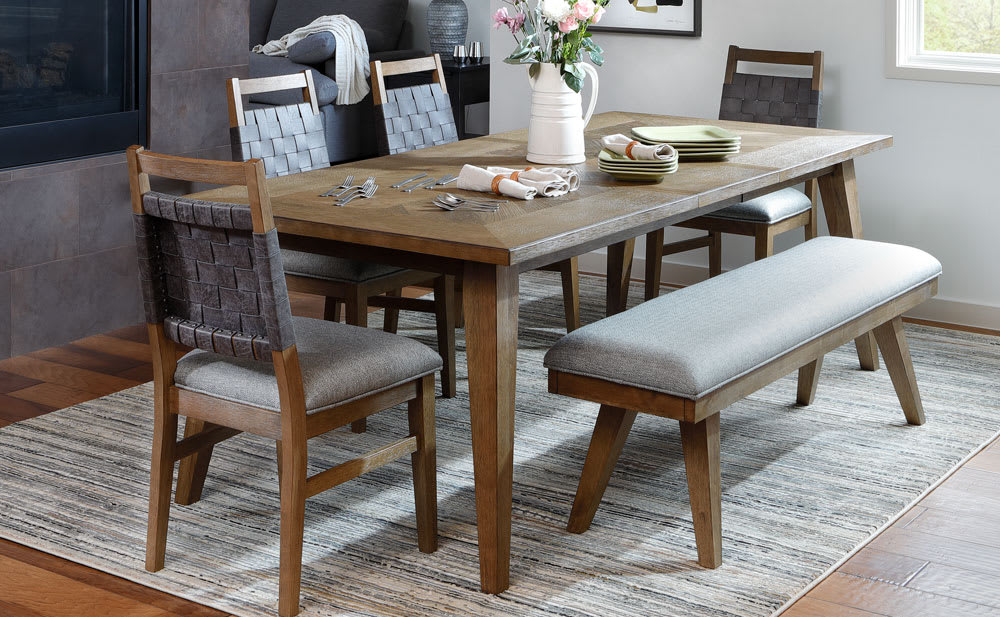 Wooden Dining Table With Leather Woven Chair Backs in Dining Room