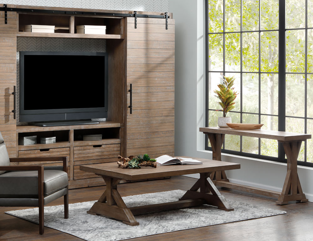 Mocha mousse colored entertainment center, coffee table, and sofa table in living room