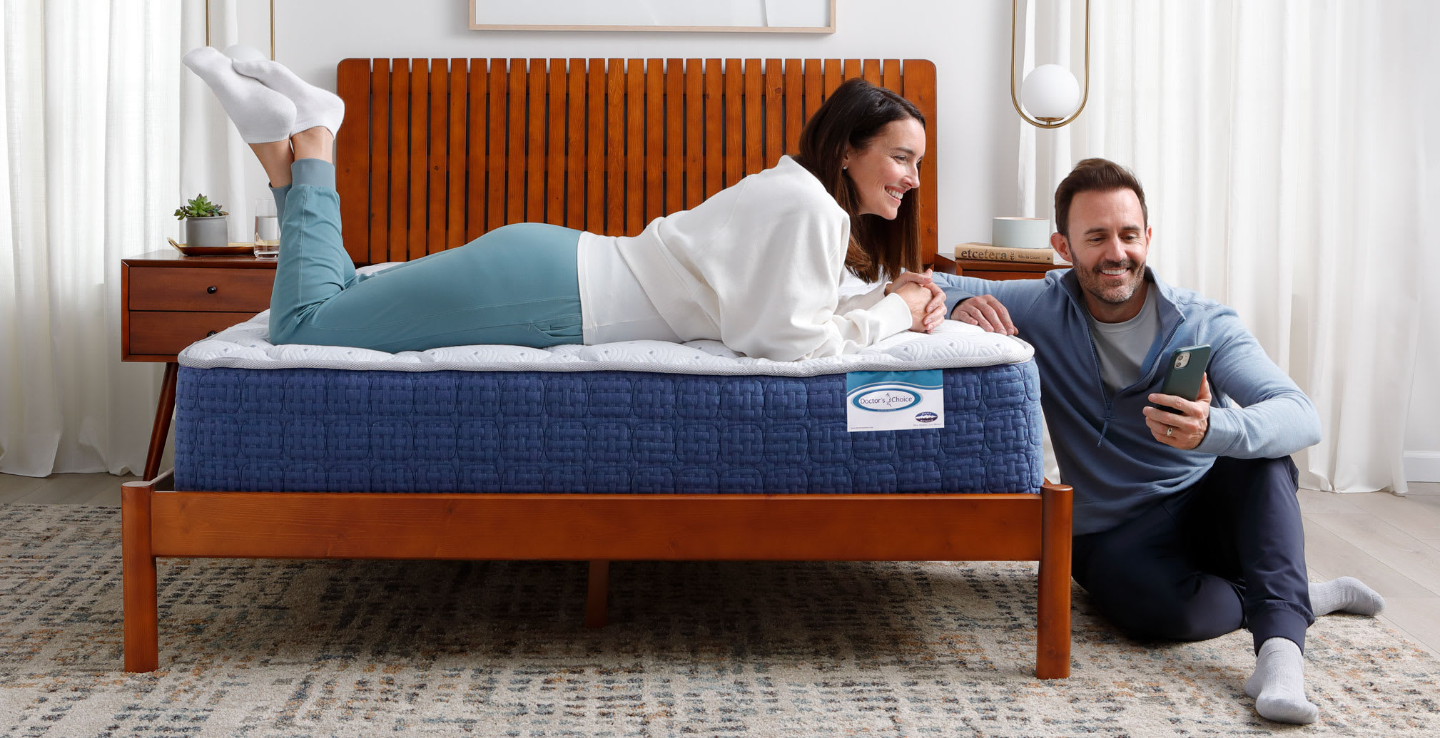 Couple hanging out on Doctor's Choice Plush Mattress