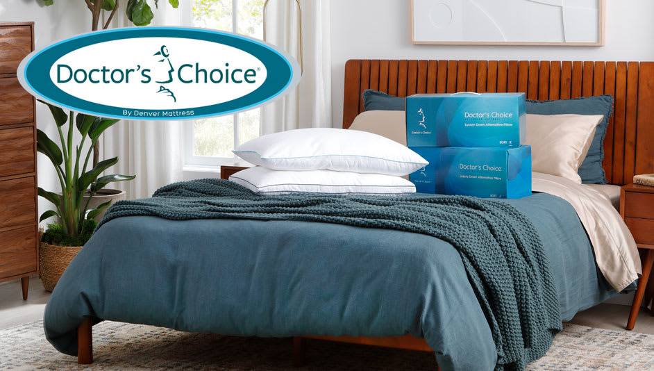 Doctors Choice Pillows on top of Bed with Teal Bedspread. Doctors Choice Logo.