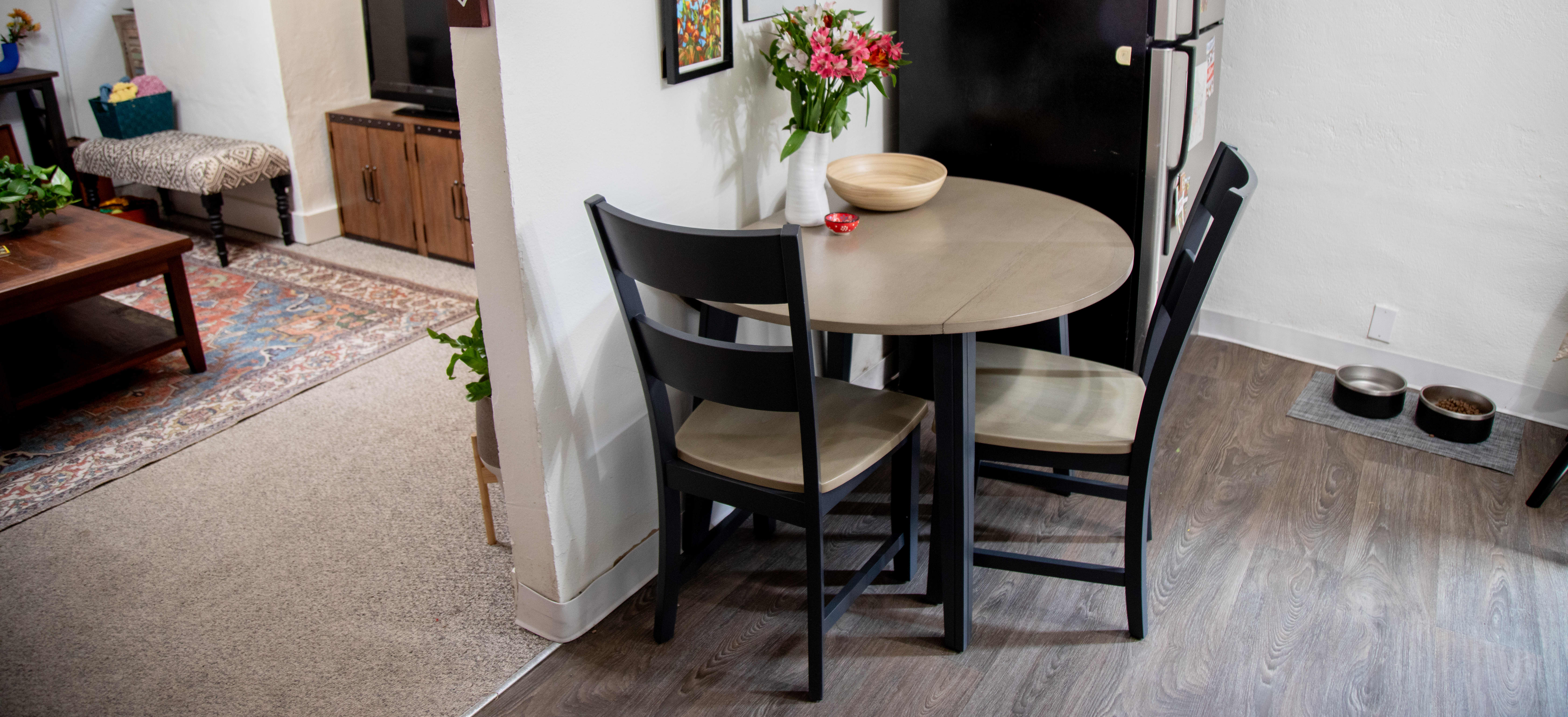 The Merrill Creek 3 Pc. Round Dining Room Set styled in Mackinley's apartment kitchen