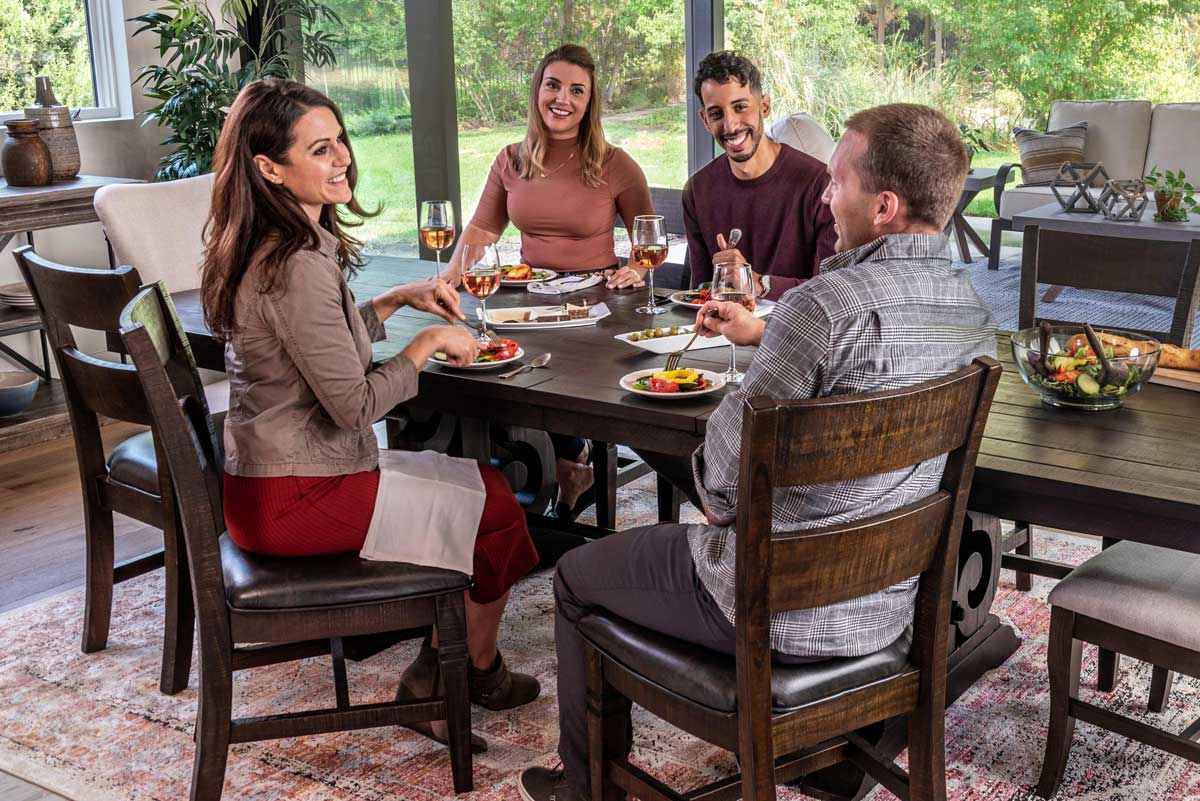 two couples eating dinner around the Sedona Dining Table Set