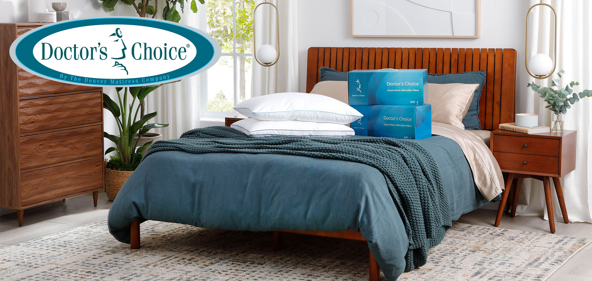 Two Doctor's Choice Pillows on top of Bed with Doctor's Choice by Denver Mattress Logo.