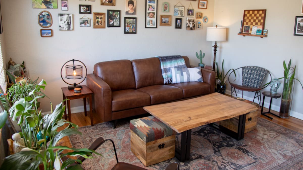 A brown leather sofa, the Tivoli Sofa, with industrial coffee table in a living room
