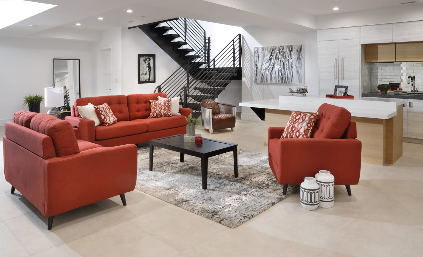 Fire red mid-century modern sofa, loveseat, and chair in sleek modern open floor plan