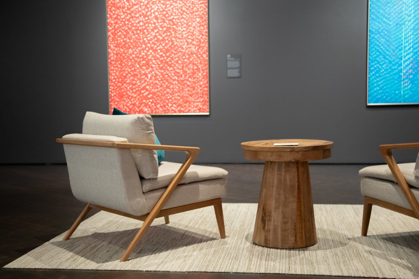 Shot of two mid-century modern Liz Arm Chairs accompanied by Sol Round End Table at the Denver Art Museum