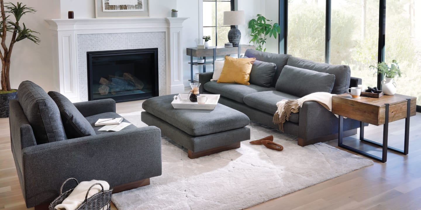 The Theo Sofa, Chair, and Otttoman styled in a fresh modern living room window scene