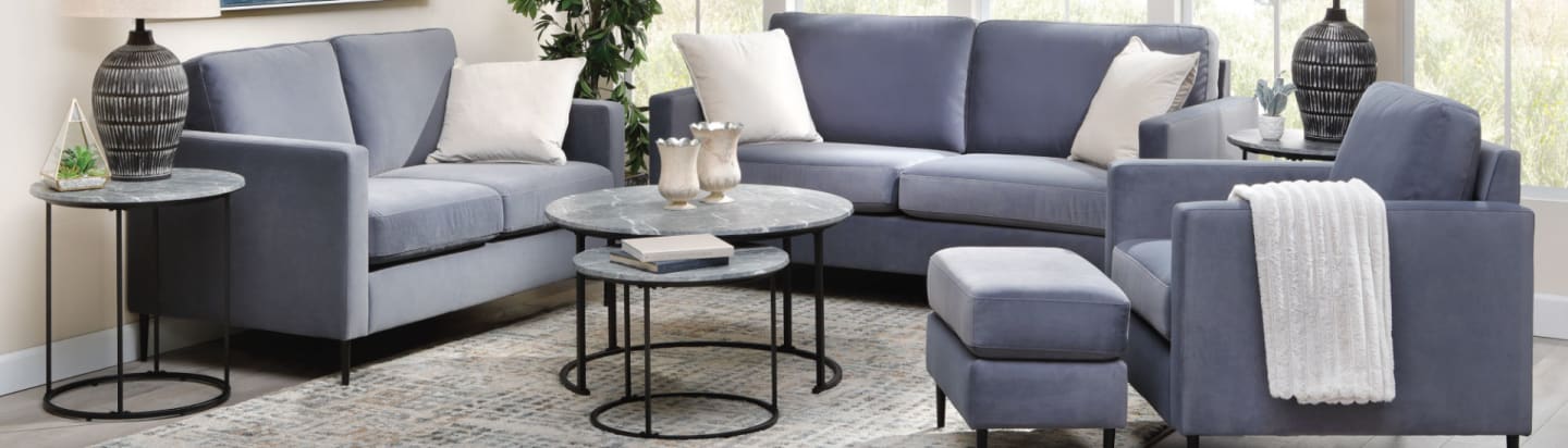 A cozy sofa group with round coffee tables in room