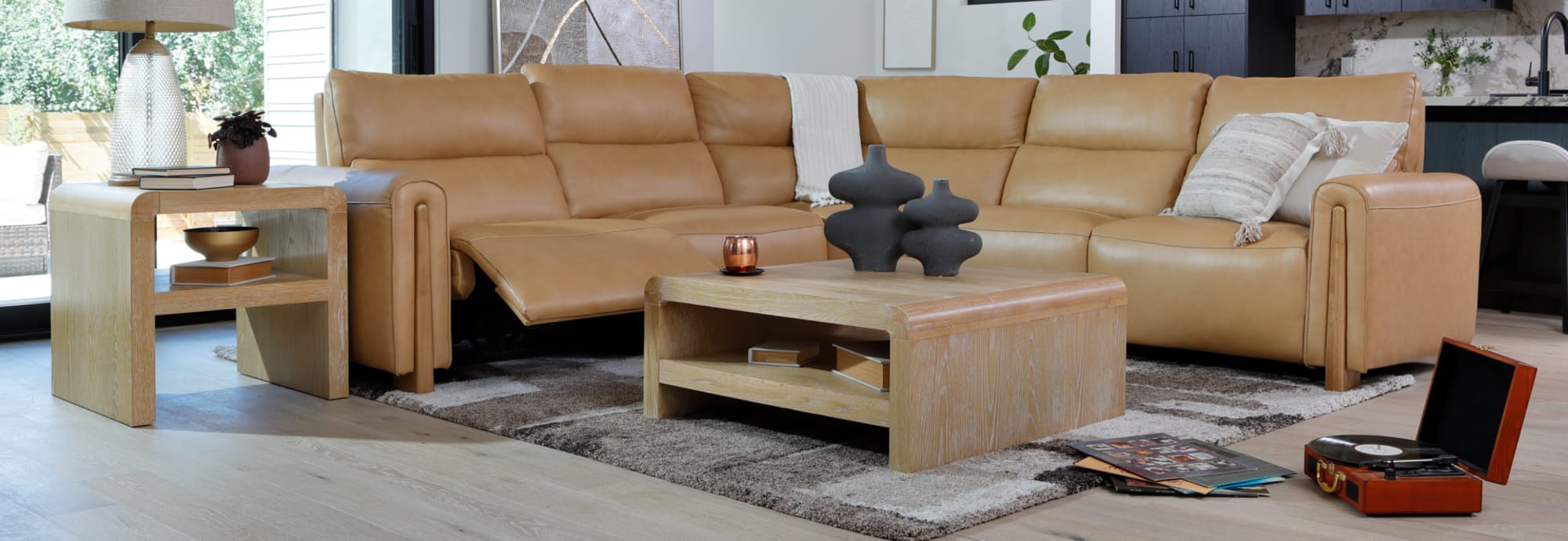 Camel Brown Leather Sectional with Wood Detail in Living Room