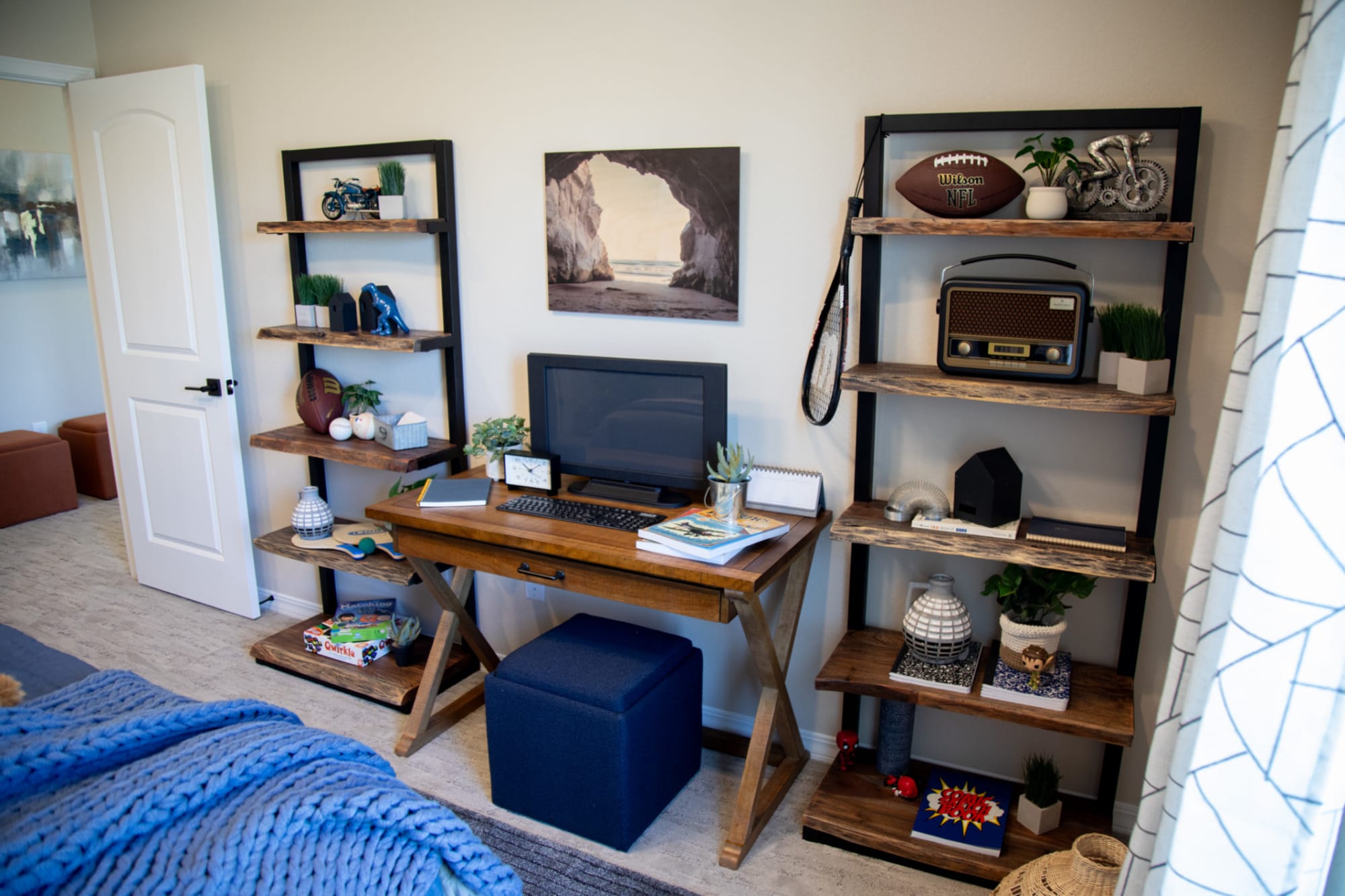 Two Knox Bookcases on either side of a wood writing desk in a bedroom scene
