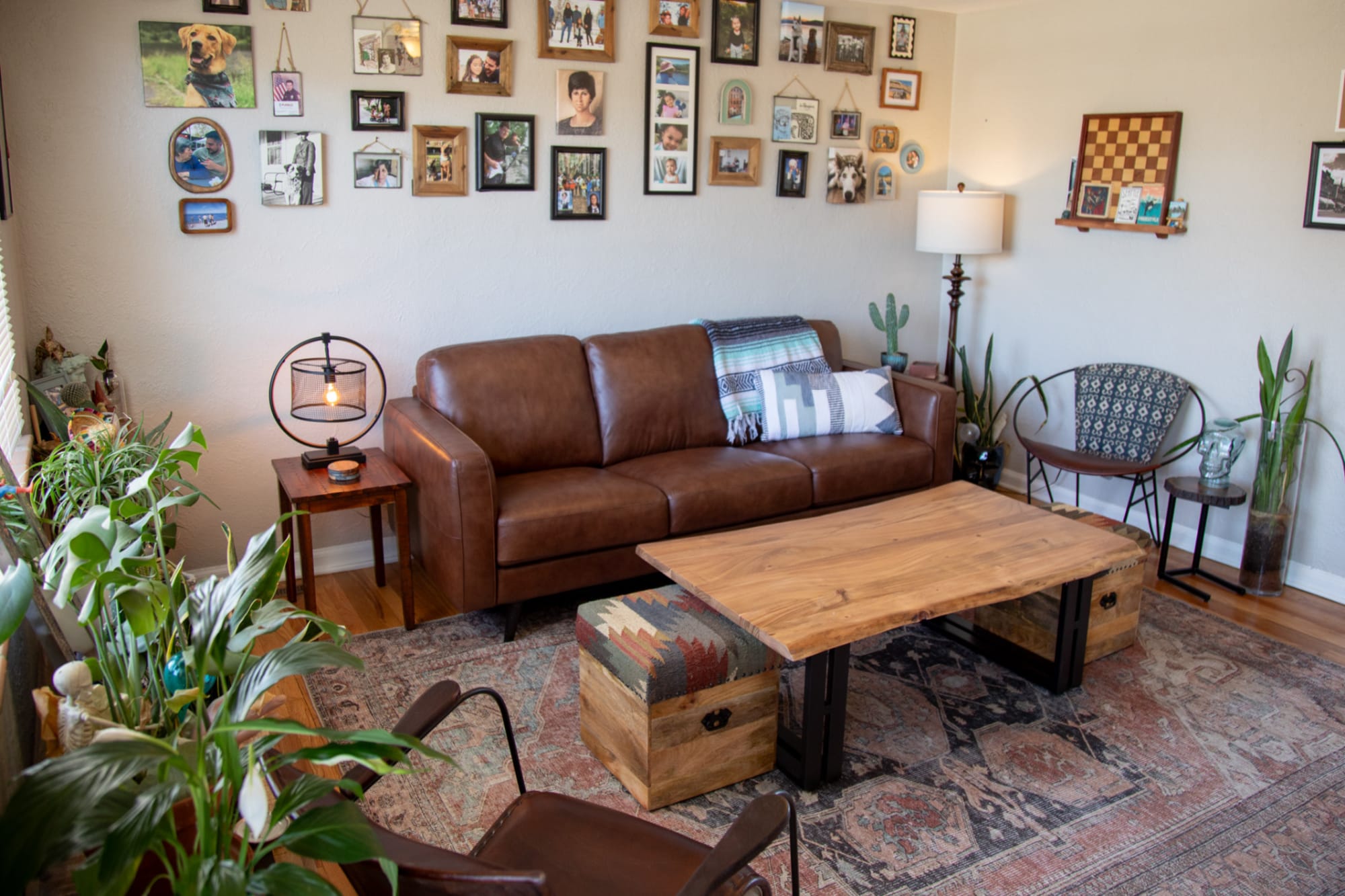 A brown leather sofa, the Tivoli Sofa, with industrial coffee table in a living room