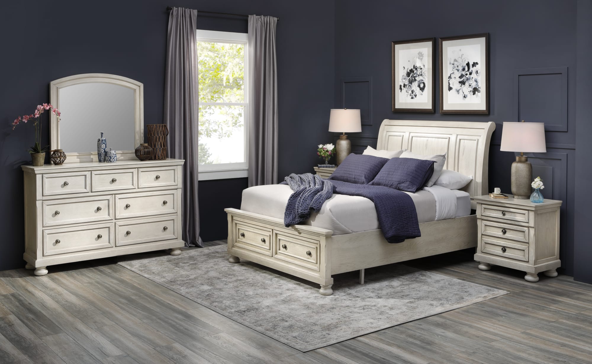 White Wooden Sleigh Bed Set with matching pieces in a dark colored bedroom