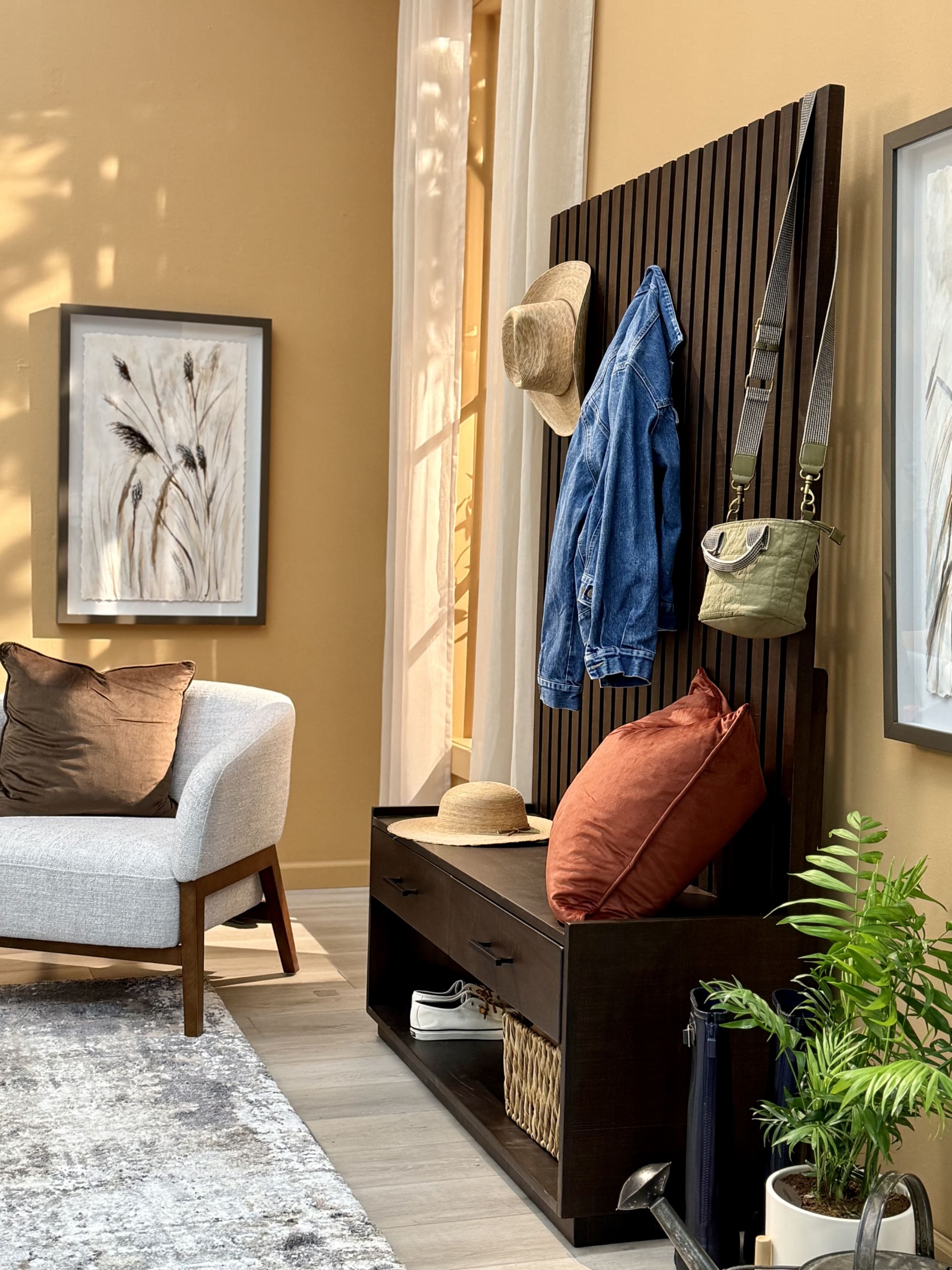 A dark wood hall tree organizer seen at an angle in a contemporary entryway