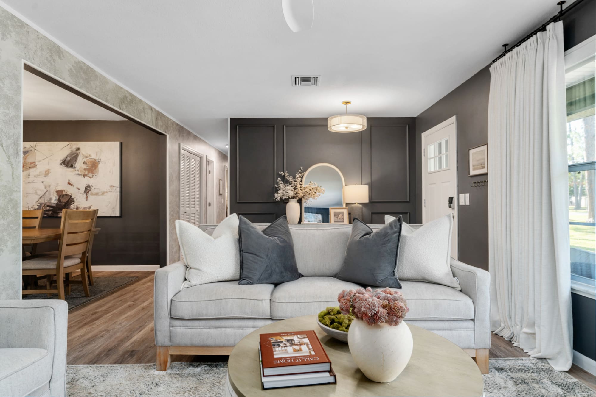 Close up of coastal gray sofa in Kelli Bateman's Airbnb living room