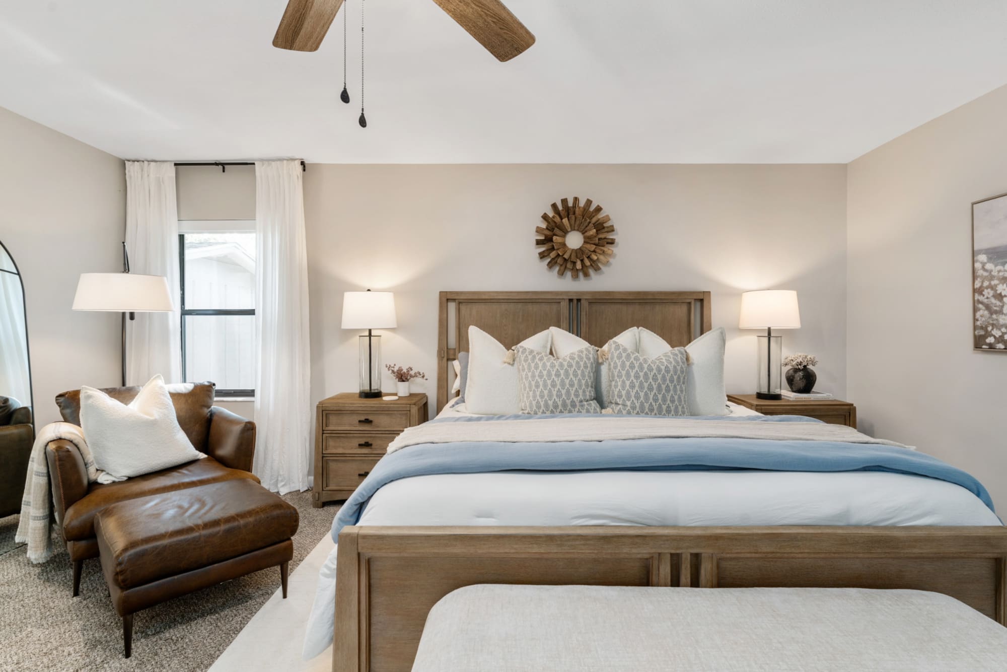 Wooden bed frame with built-in storage in Kelli Bateman's Airbnb adult bedroom