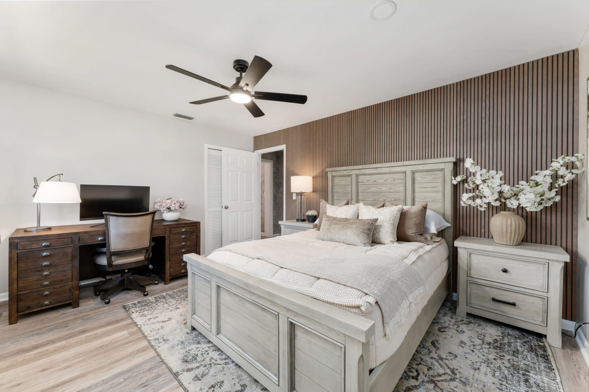 Rustic gray panel bed with two matching nightstands in Kelli Bateman's Airbnb fourth bedroom