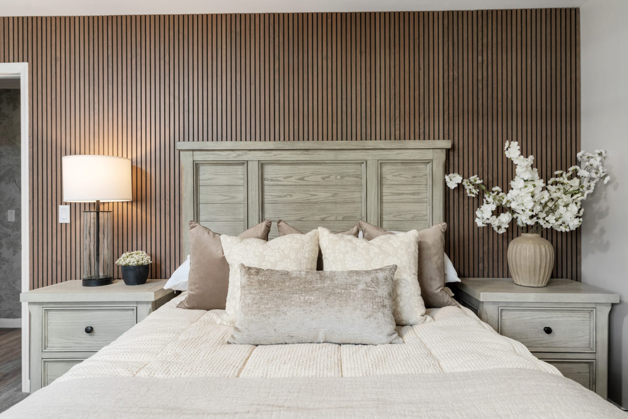 Closeup of gray panel bed headboard in Kelli Bateman's Airbnb fourth bedroom