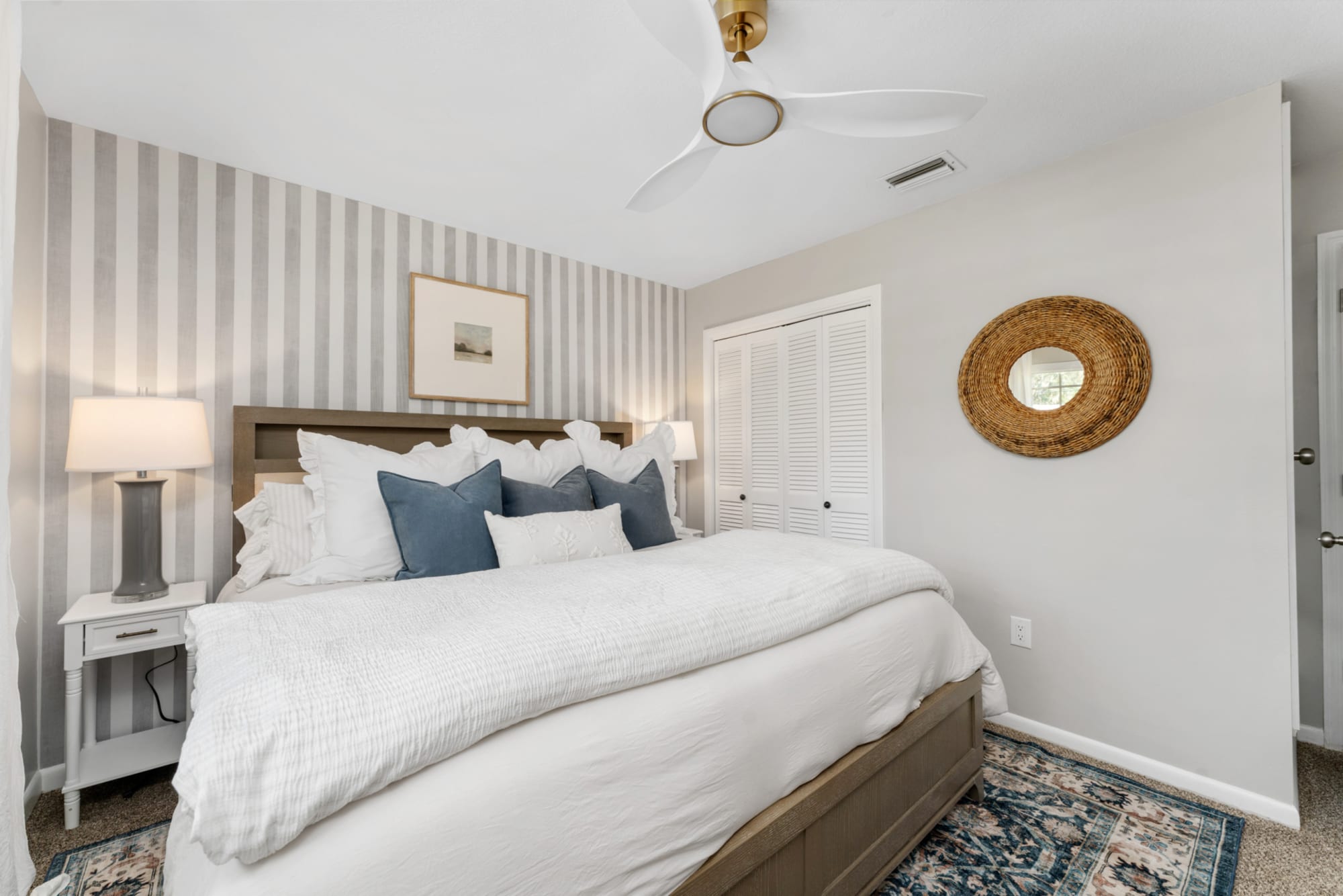 Queen sized wood panel bed in Kelli Bateman's Airbnb second adult bedroom