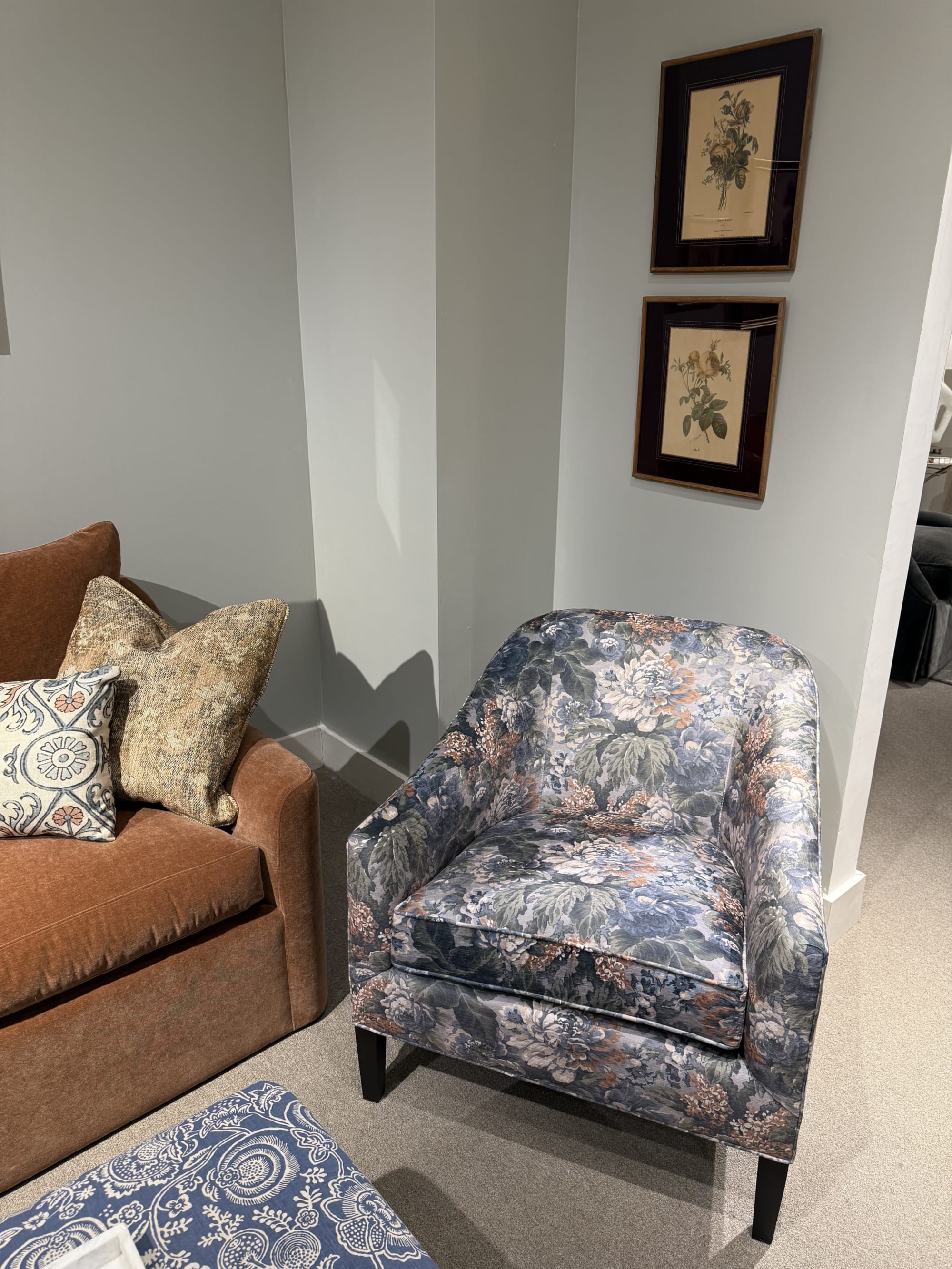 A floral accent chair against a pale wall at High Point Marketplace