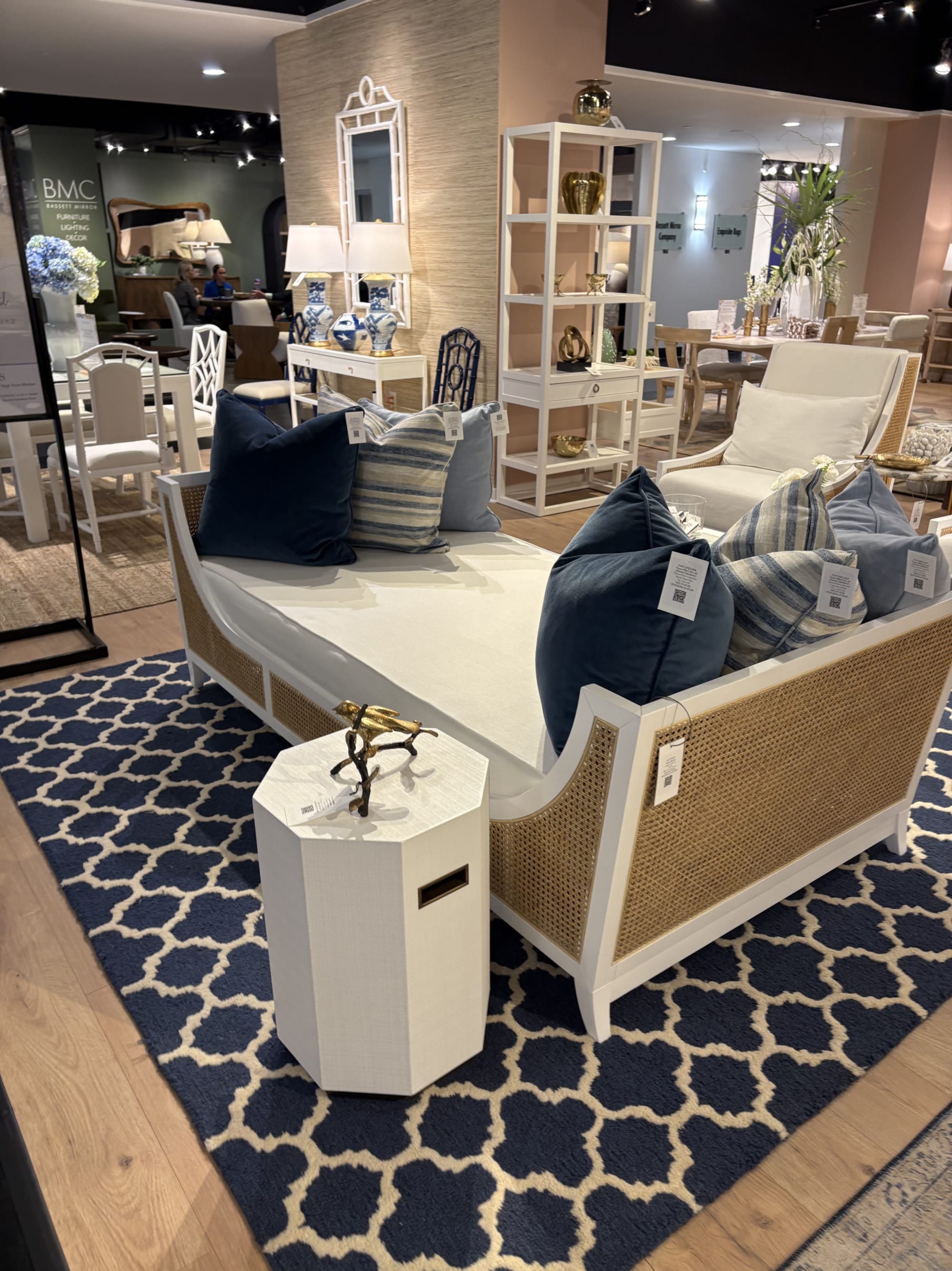 A daybed with caning side details at High Point Marketplace