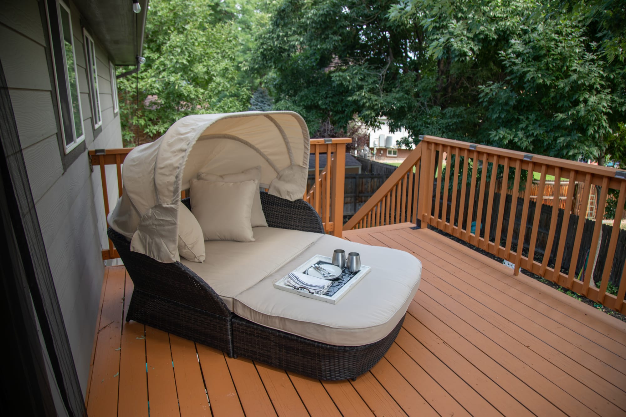 The Surfside Daybed styled on back deck for Kate's Real Spaced home tour