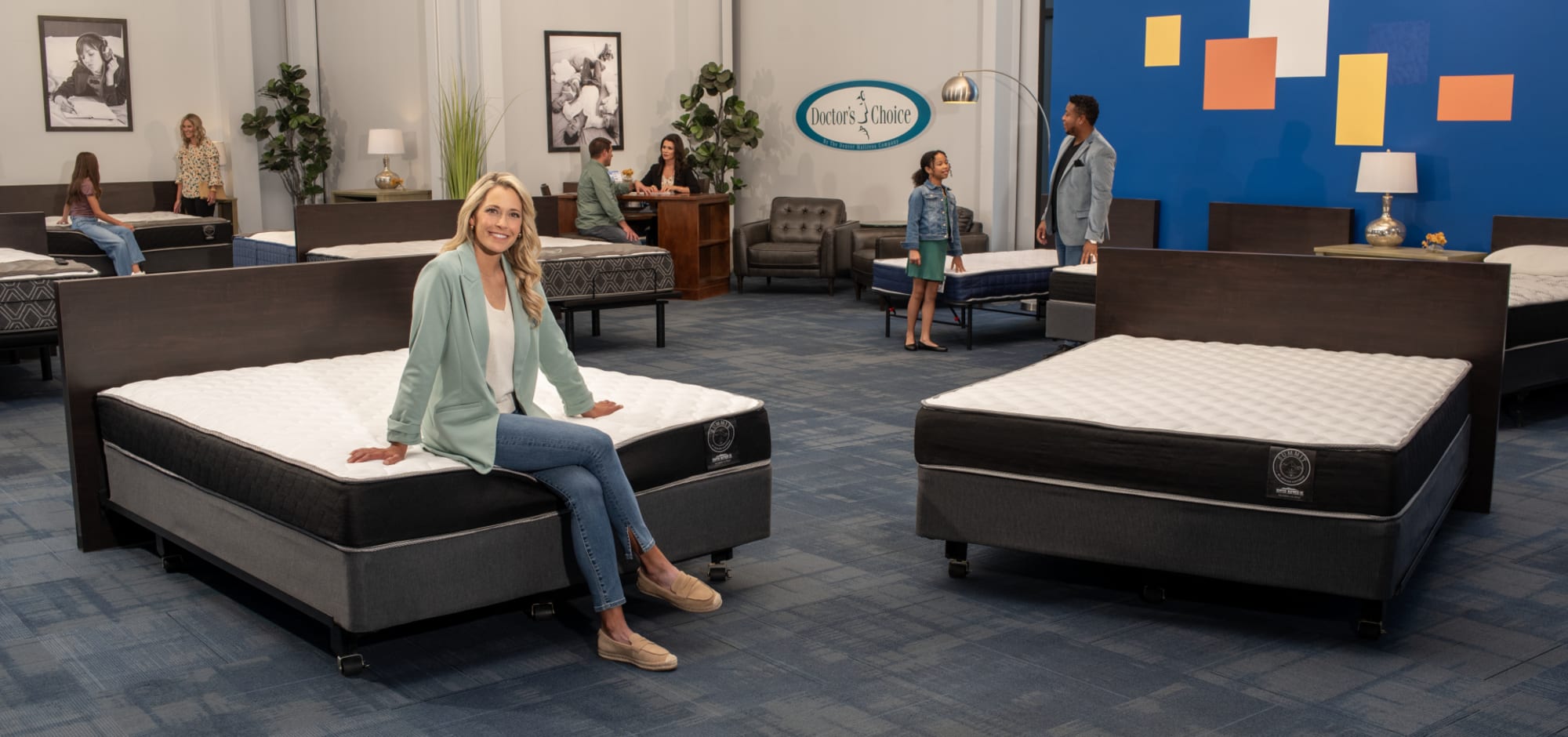 Summit Mattress Section in Denver Mattress Store with Customers and Spokeswoman