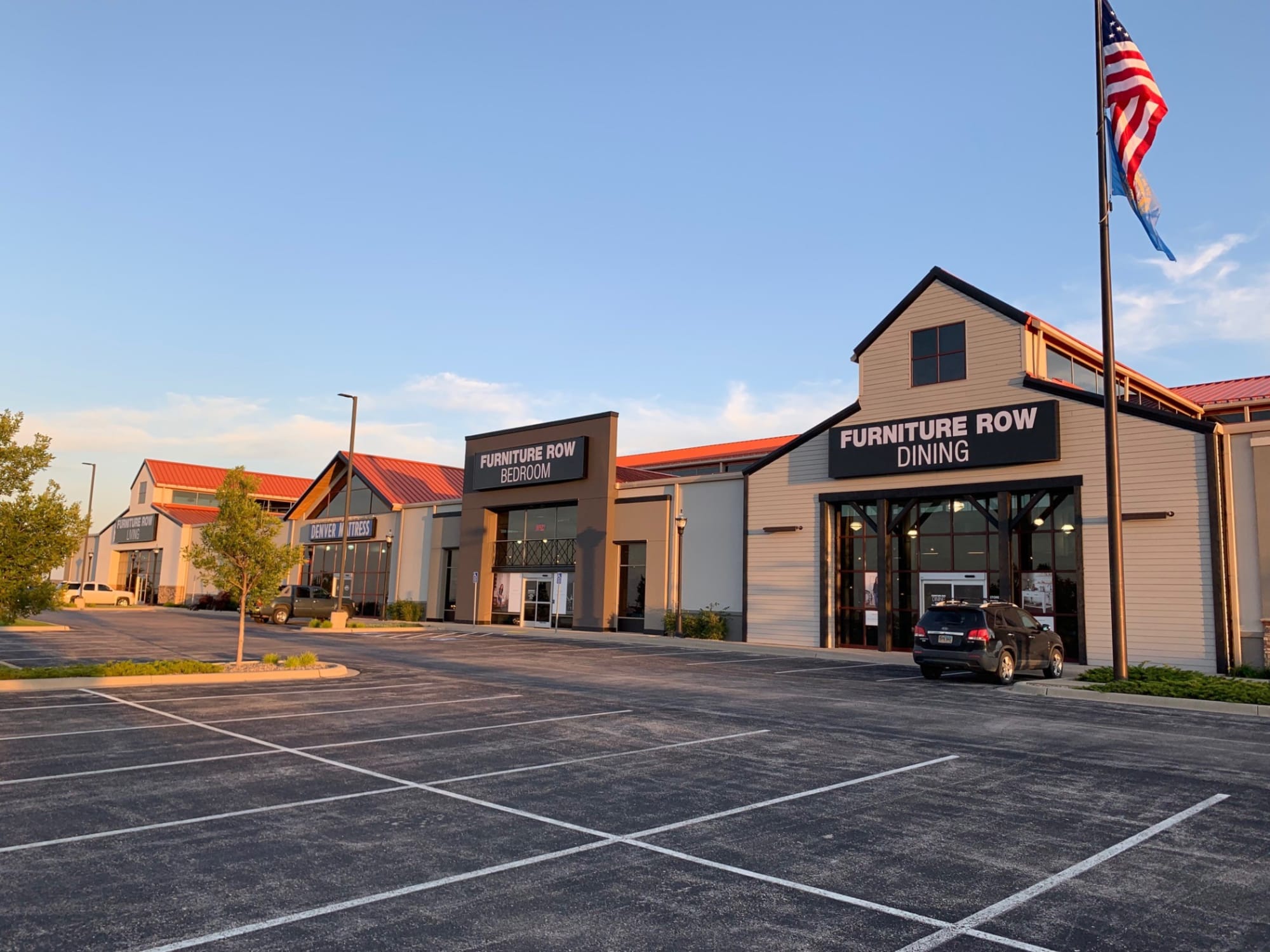 Furniture Row Dining, Furniture Row Bedroom, Denver Mattress and Furniture Row Living Parking Lot and Building Exterior