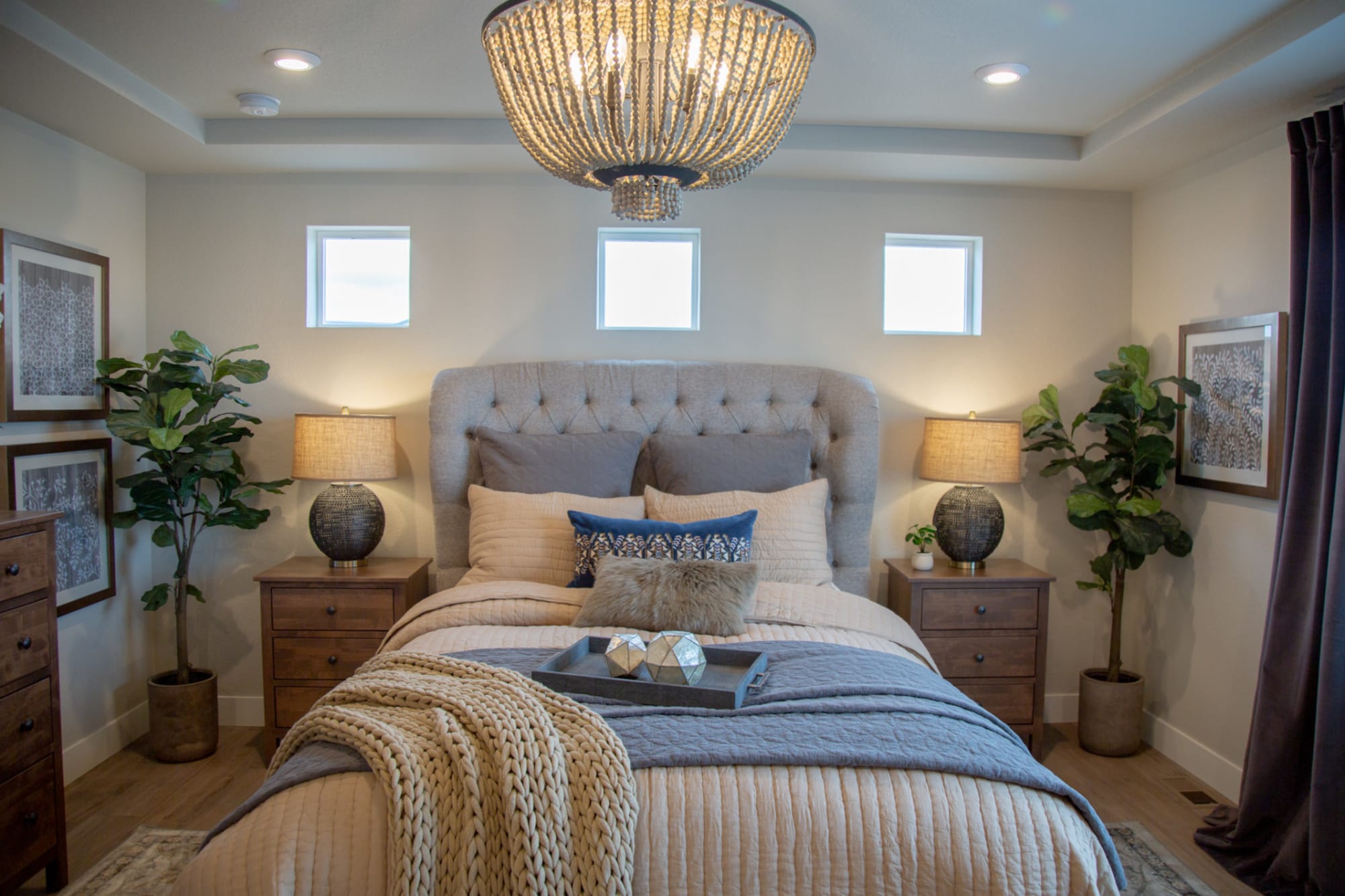 Gray button tufted upholstered bed in bedroom