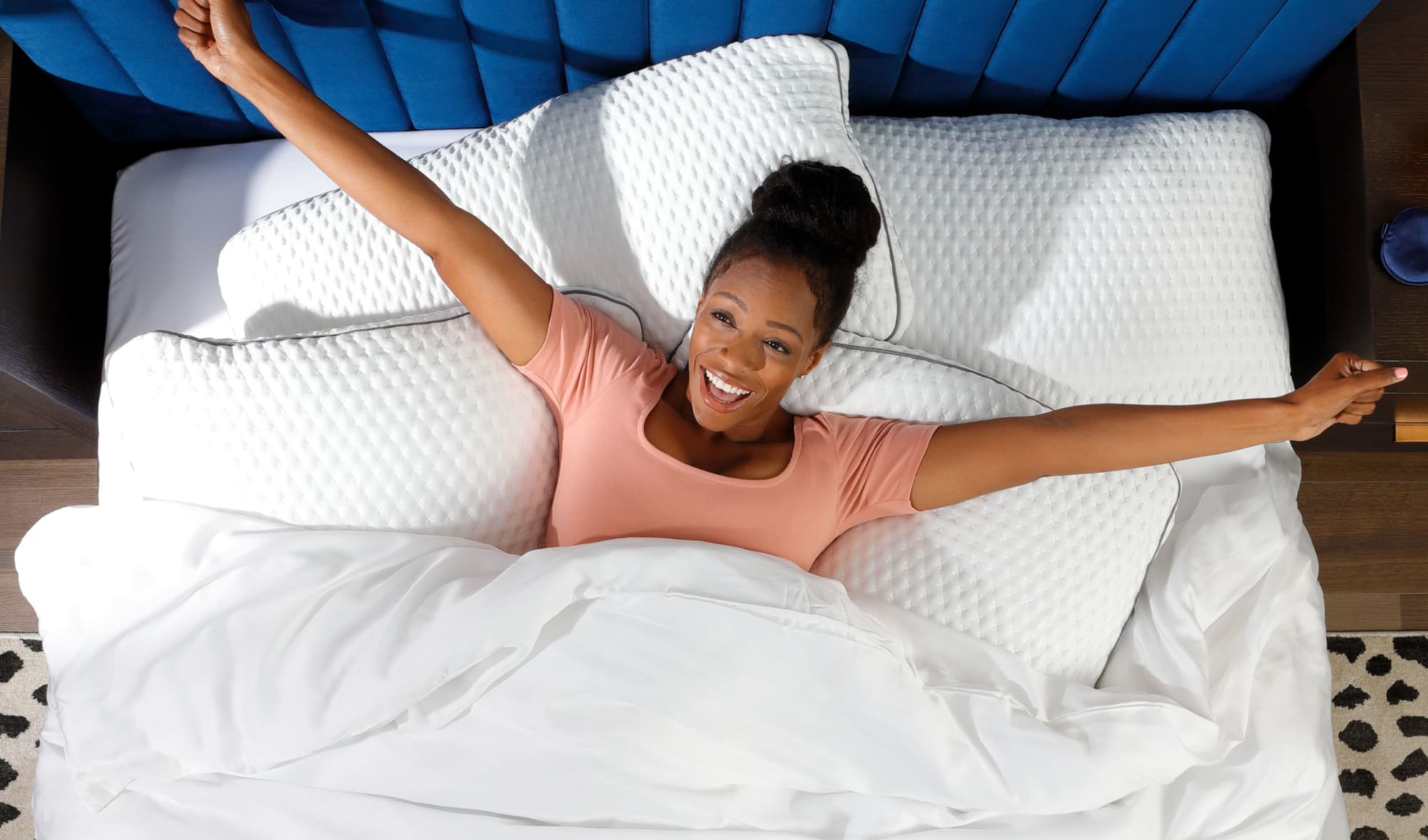 Woman stretching in bed