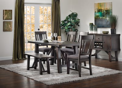 Classic farmhouse dark wood dining set with bench and four chairs accompanied by matching server in dining room window scene
