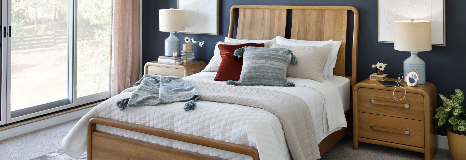 Light wood bedframe in bedroom
