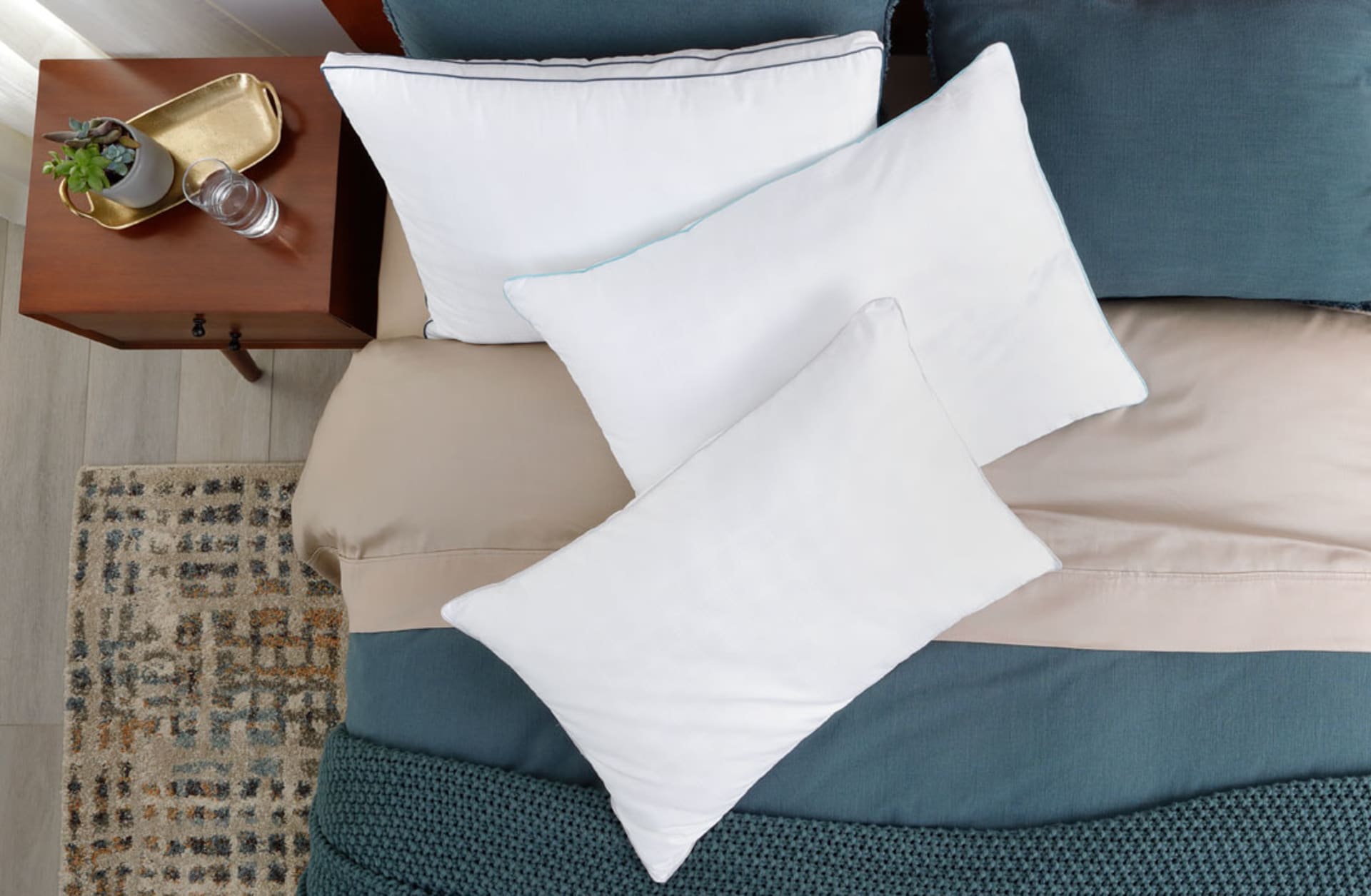 Two Doctor's Choice Pillows on Teal Dressed Bed