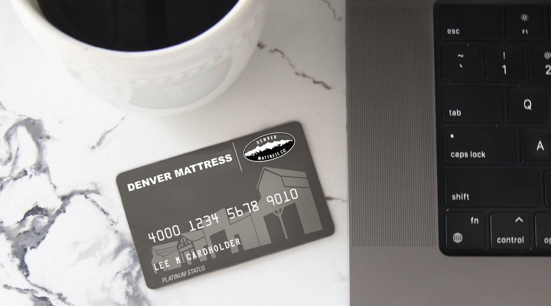 Financing Callout. Denver Mattress Card with Computer Keyboard and cup of coffee.