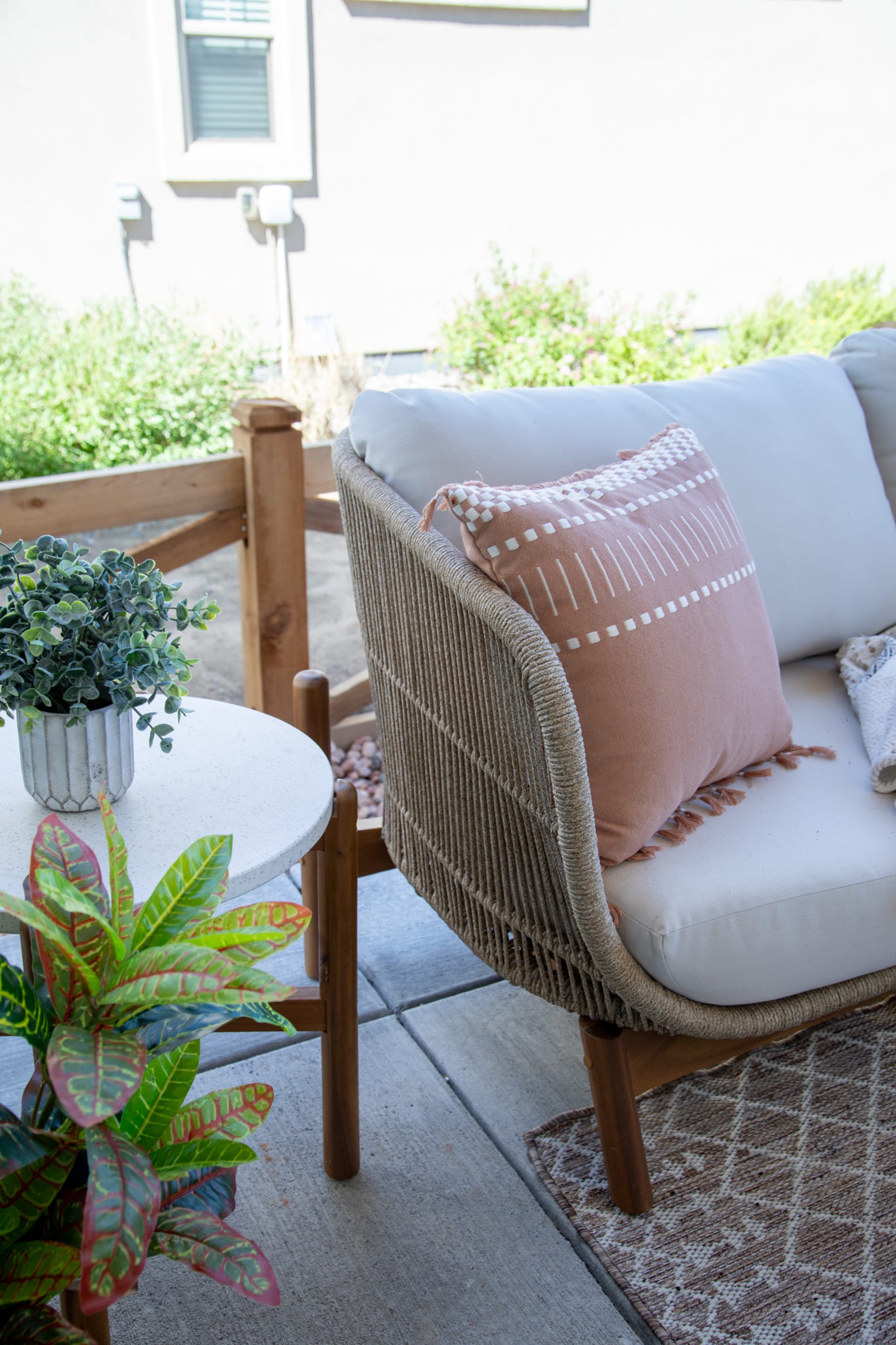 Flowood Sofa on a patio with plants