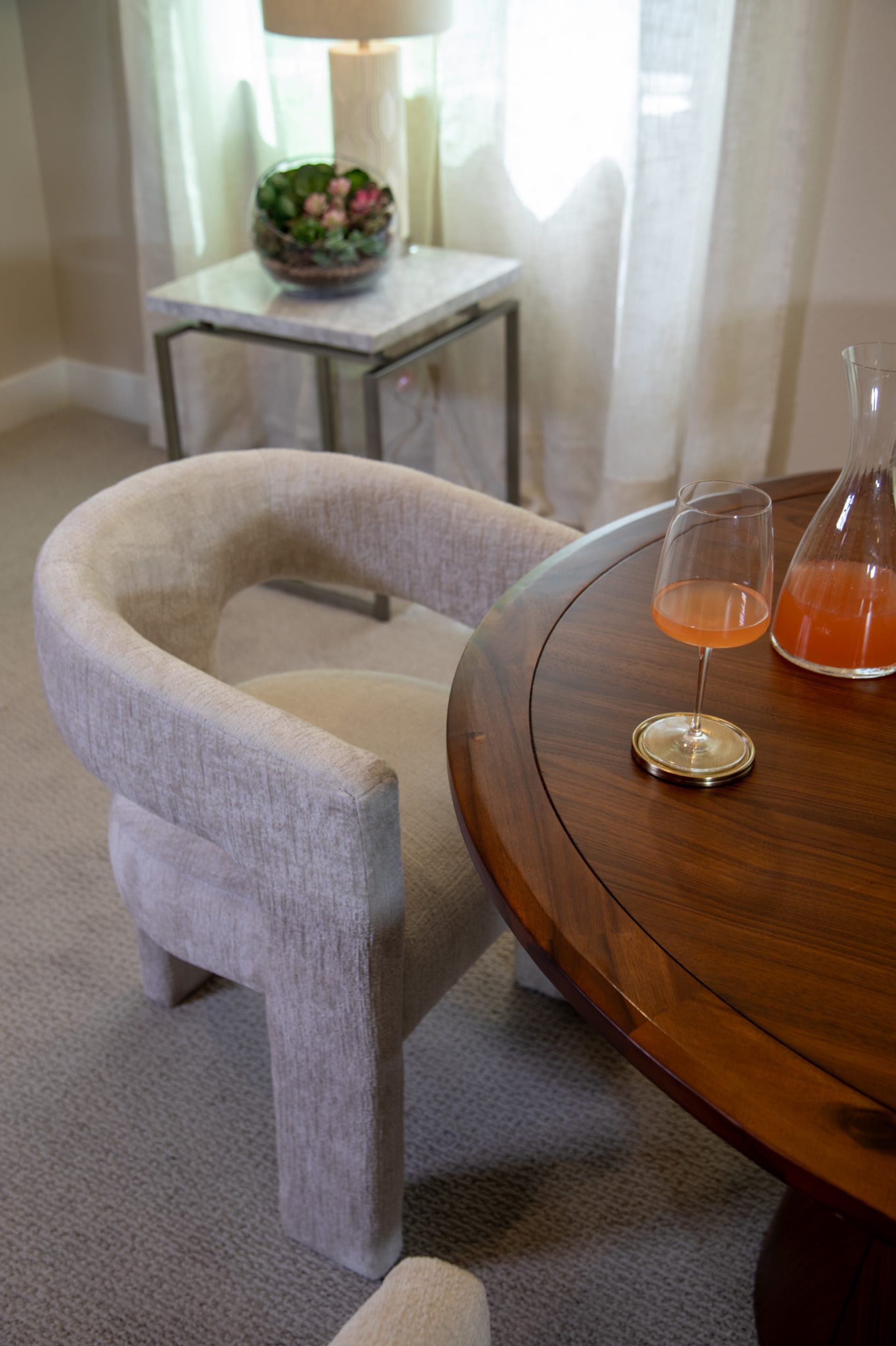 The gray Nash Dining Chair at a table