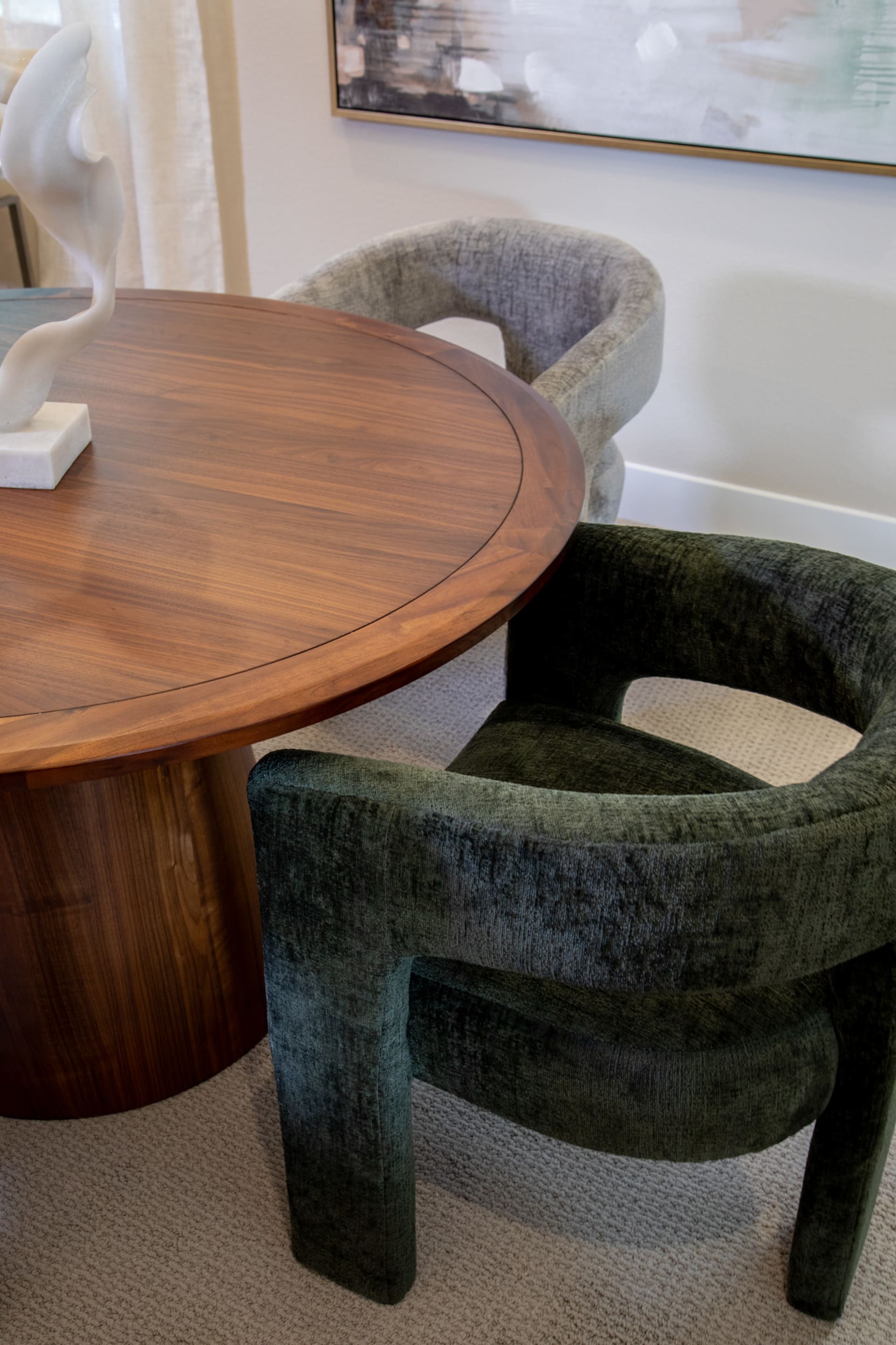 The green Nash Dining Chair at table
