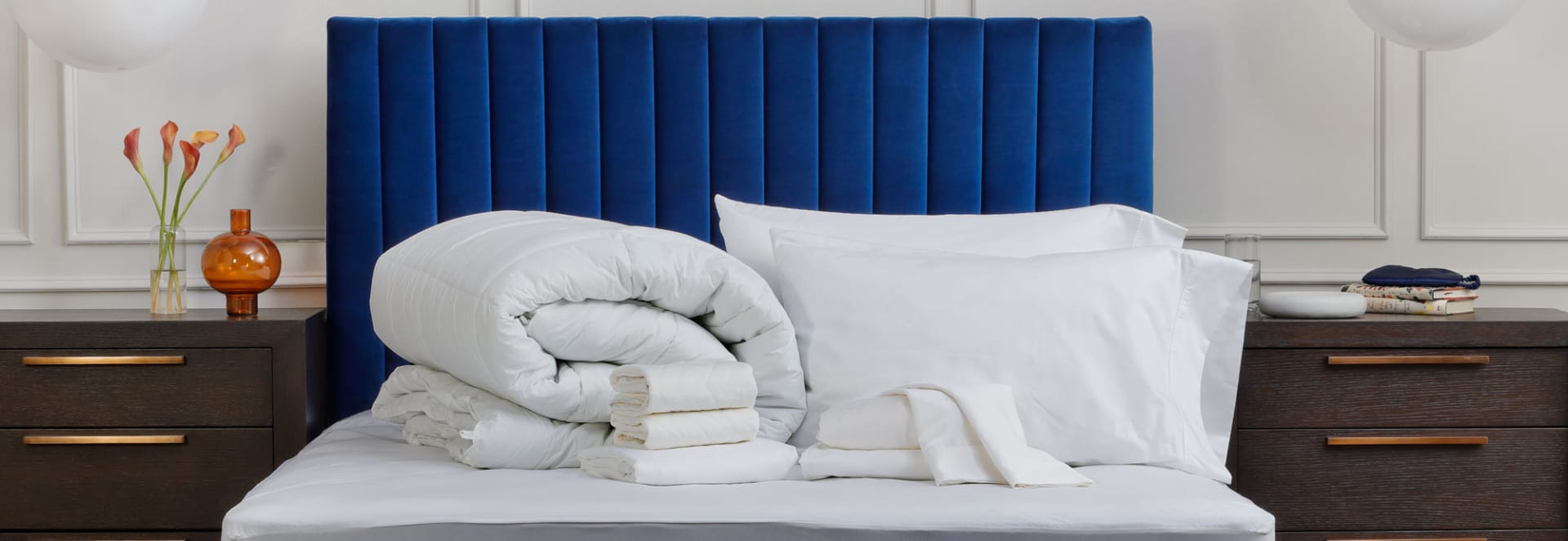 Collection of Sheets and Accessories on top of Mattress