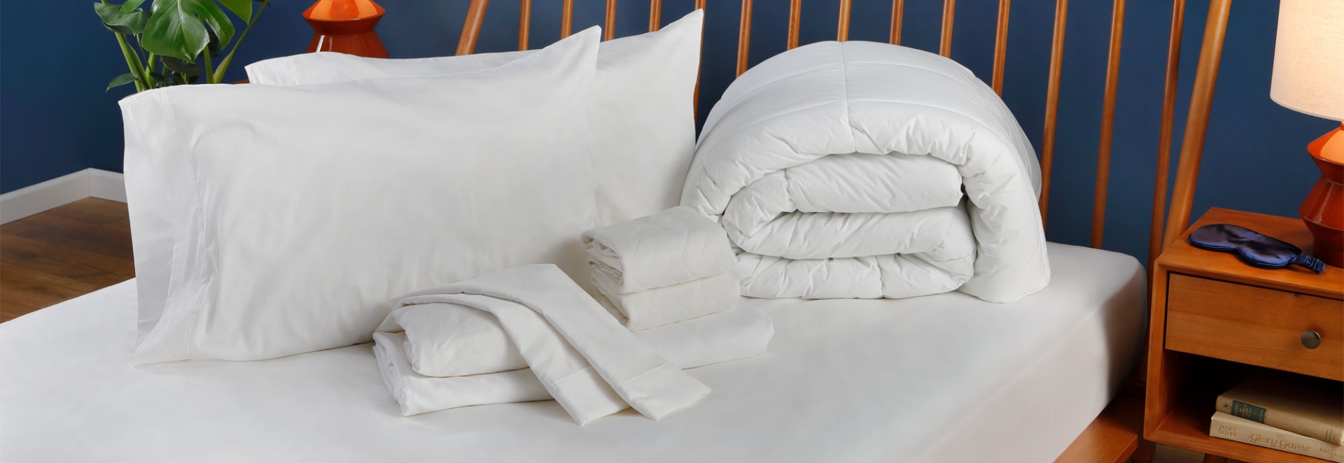 Sheets and Accessories on top of bed in bedroom